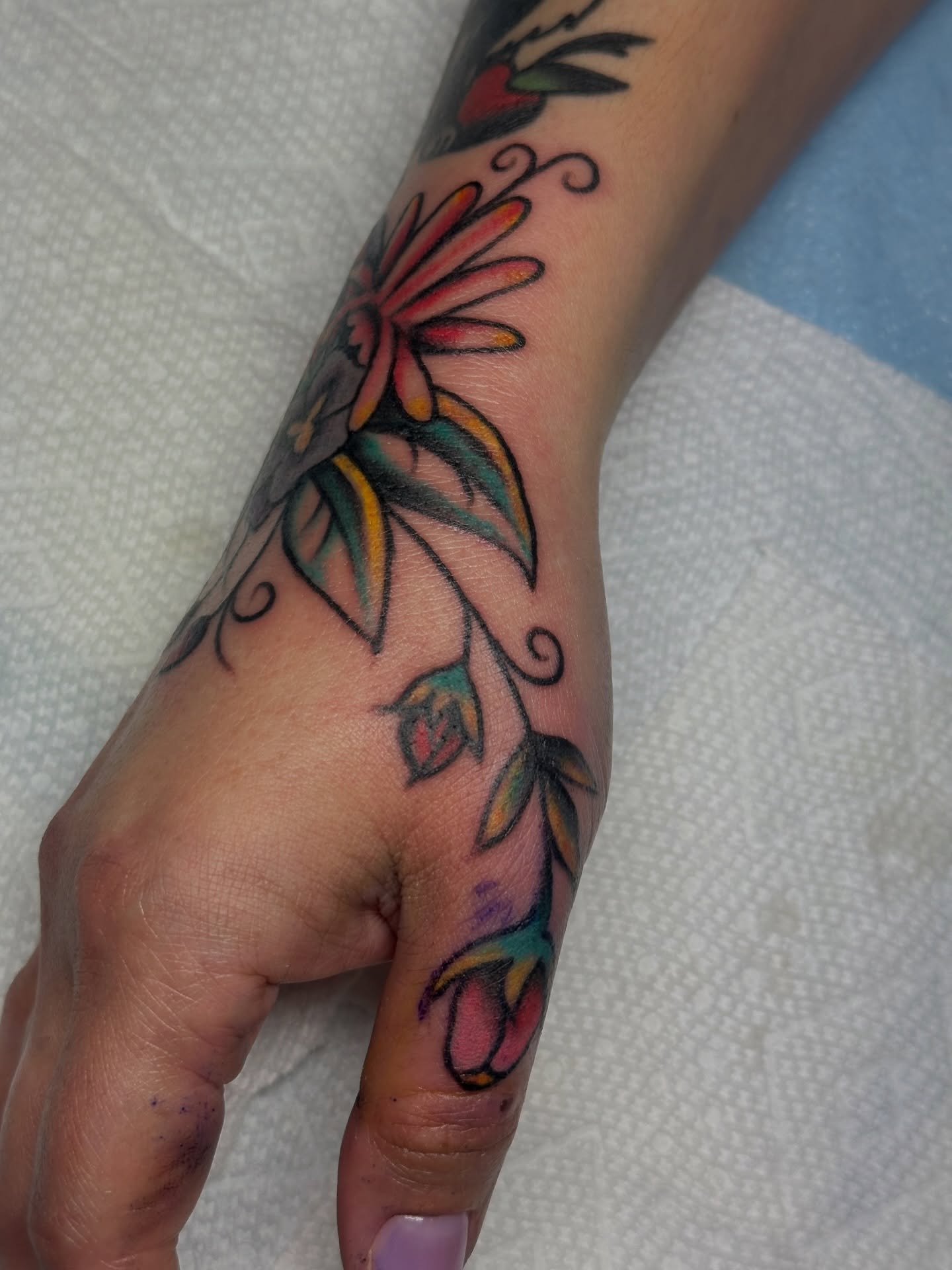 Flower vine American traditional tattoo on the forearm by Providence Tattooer