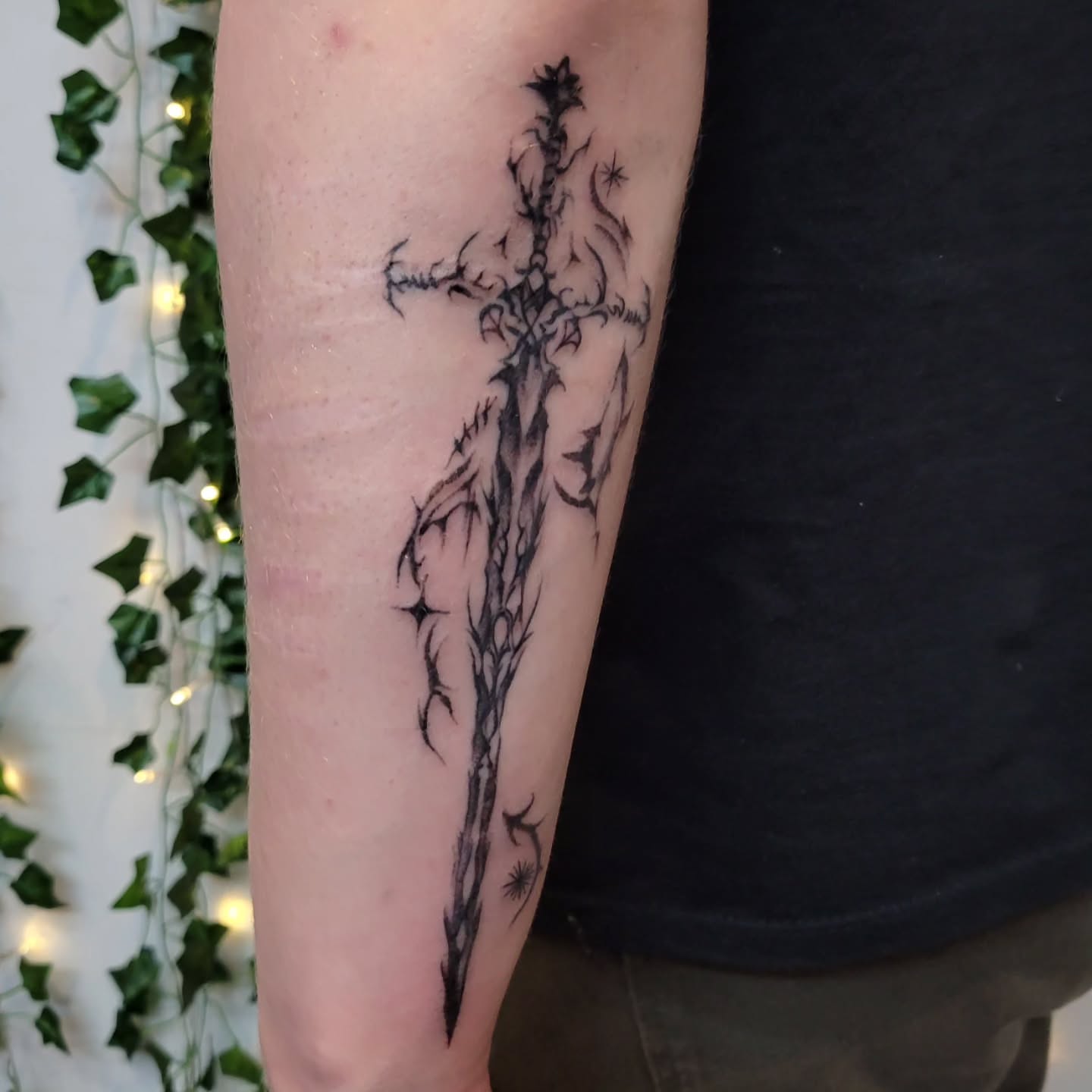 Sword black and grey tattoo on the forearm by Uku Tattoos, Cambridge, England