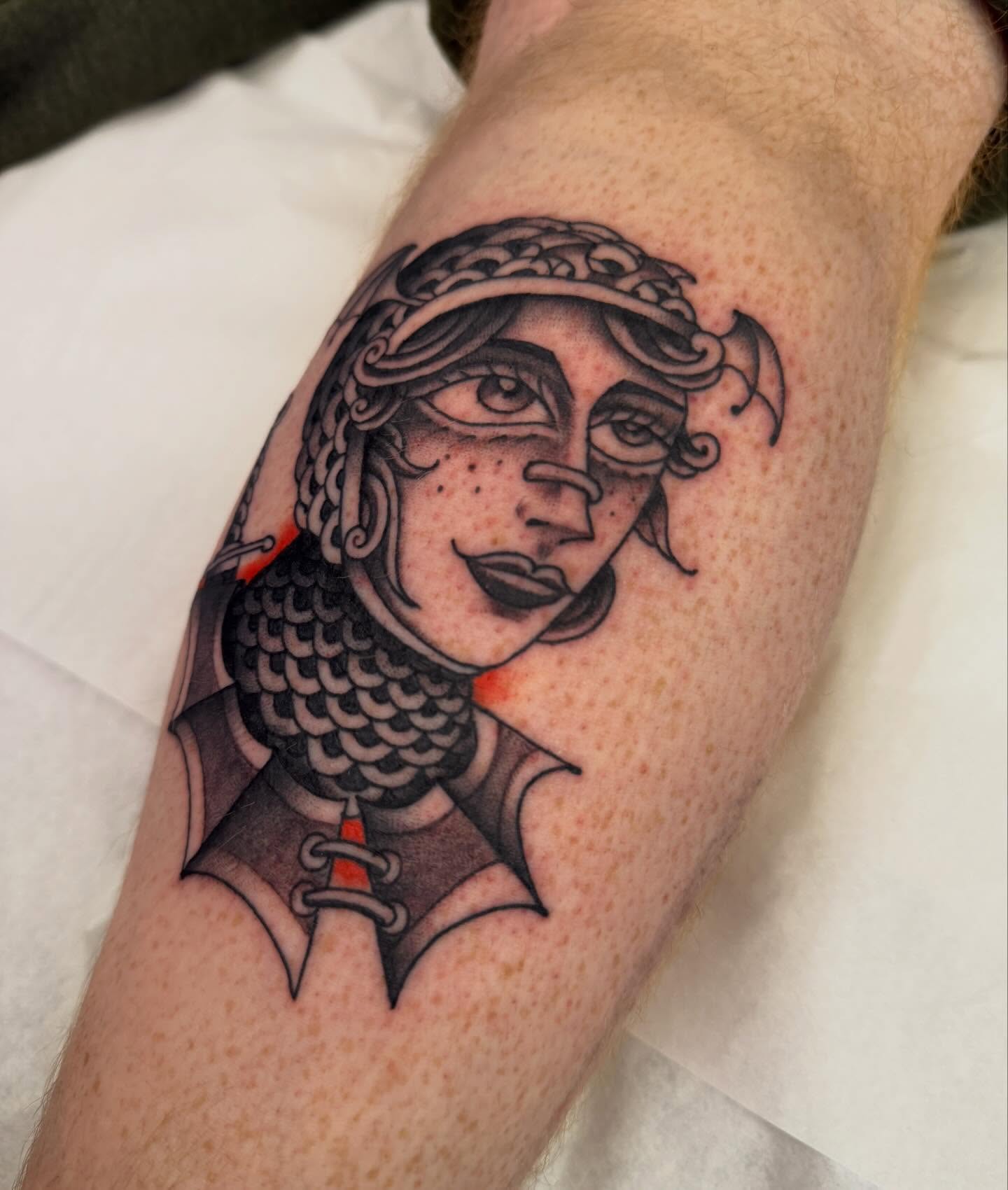 Woman with helmet black and grey tattoo on the forearm by Bryan Ortega
