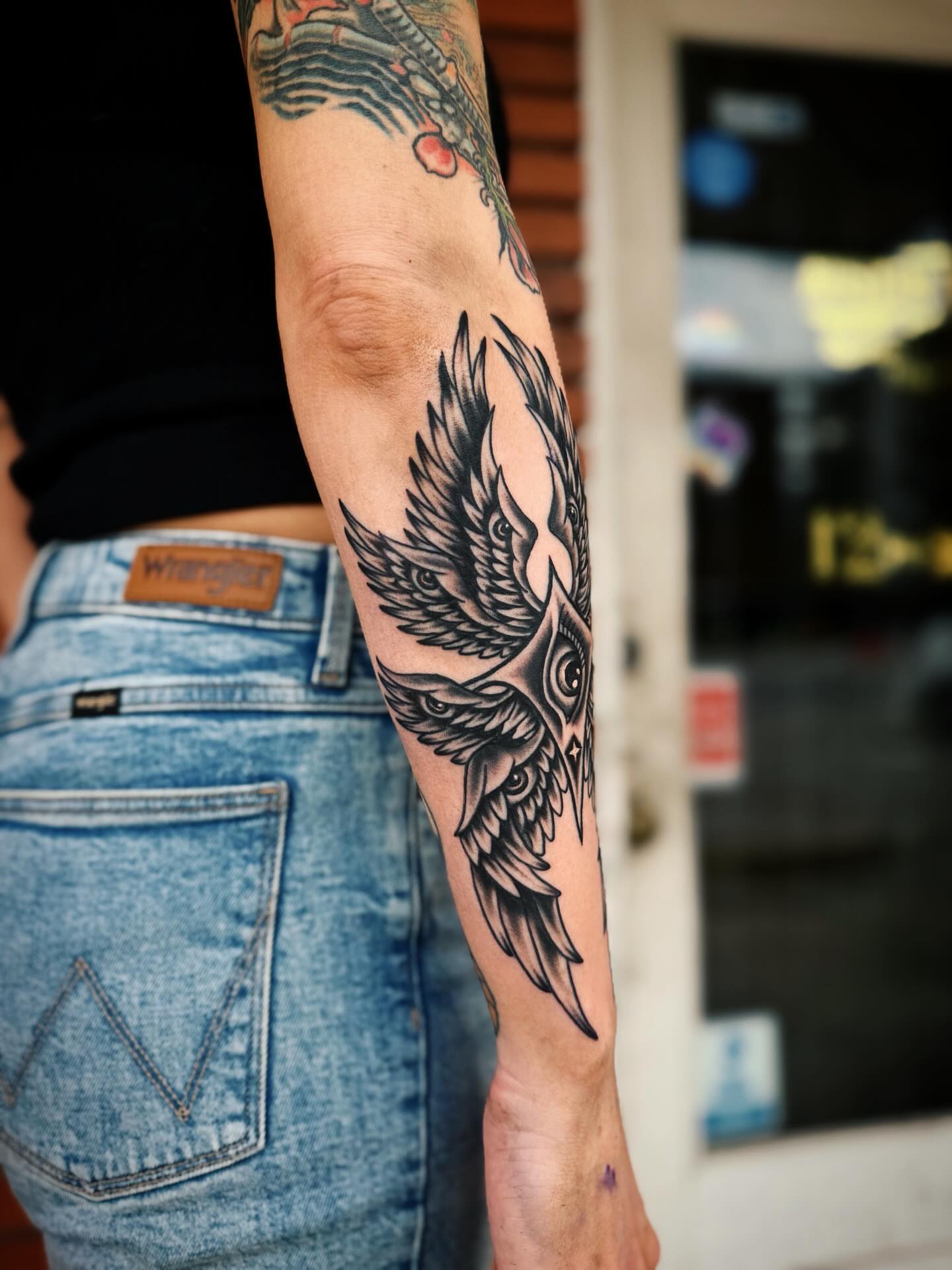 Eagle black and grey tattoo on the forearm by @amandahowtattoo