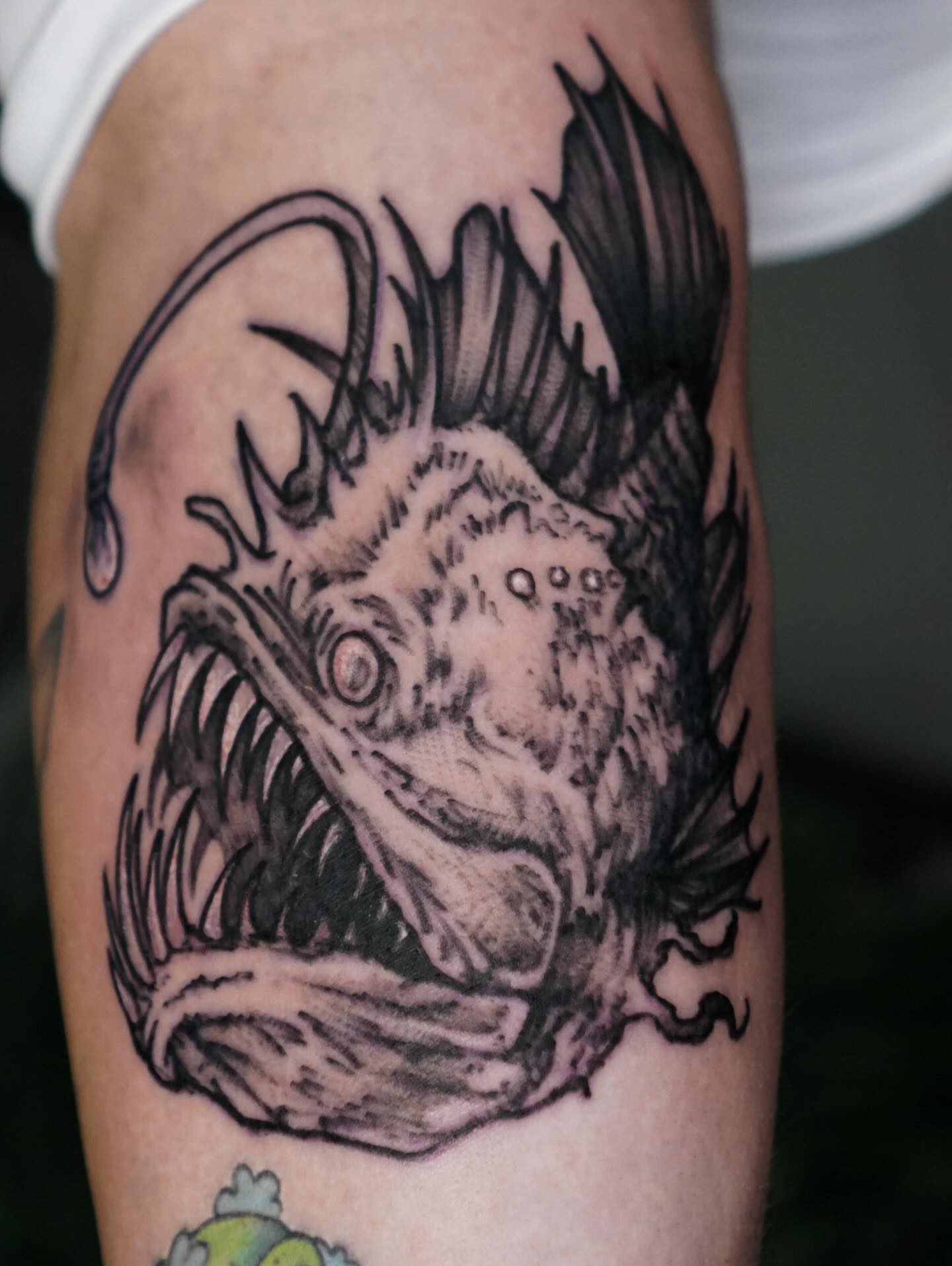Angler fish black and grey tattoo on the forearm by Nicholas Capellan, Winter Park, Florida