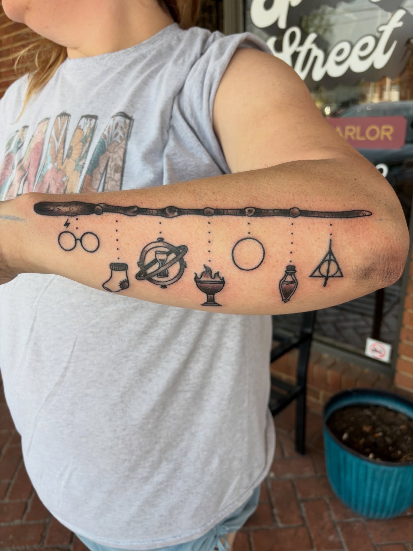 Harry Potter symbols black and grey tattoo on the forearm by AARON MASTERS - Tattoo Artist