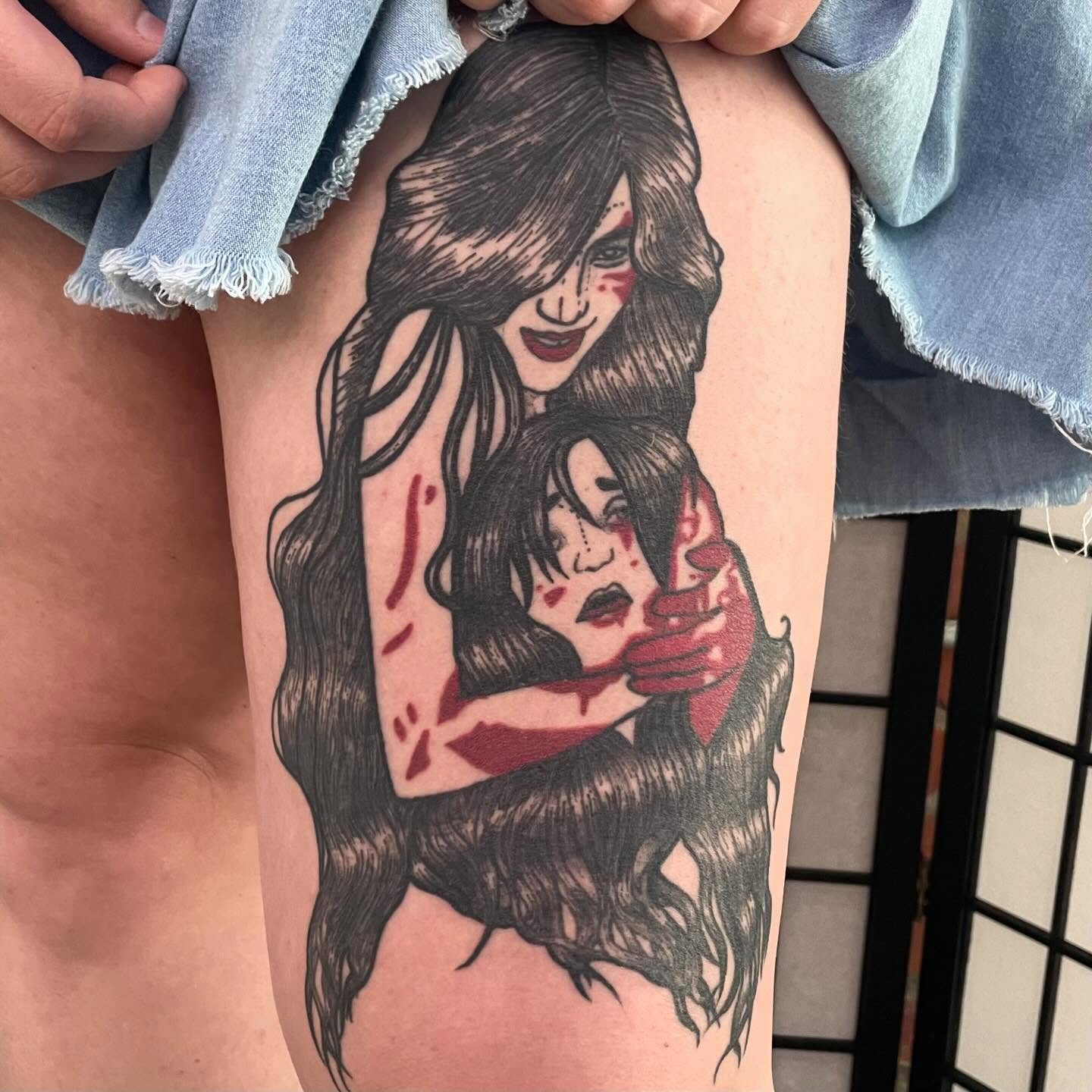 Mother and child black and grey tattoo on the thigh by Avalon Sable