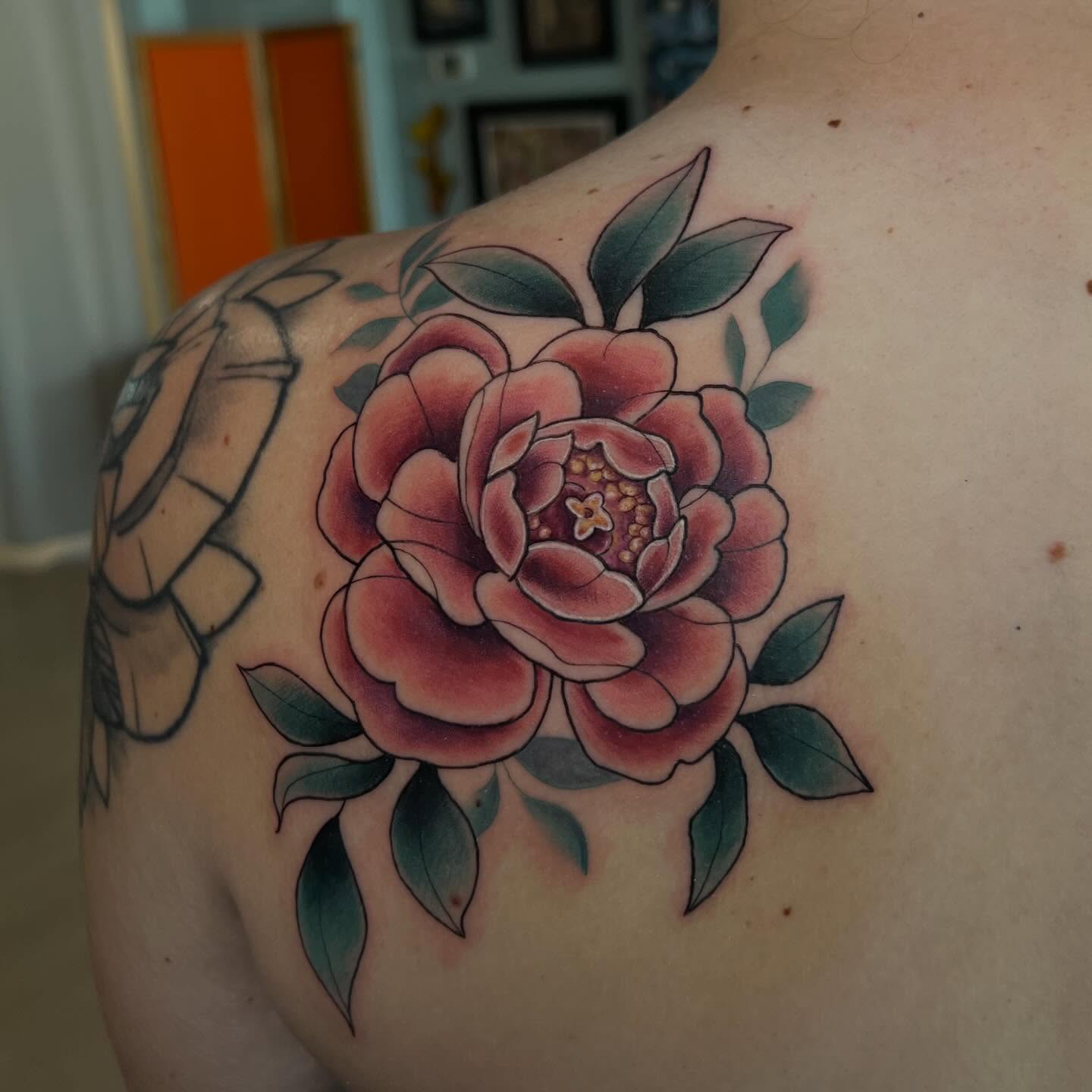Peony American traditional tattoo on the shoulder by Jessica Kloos