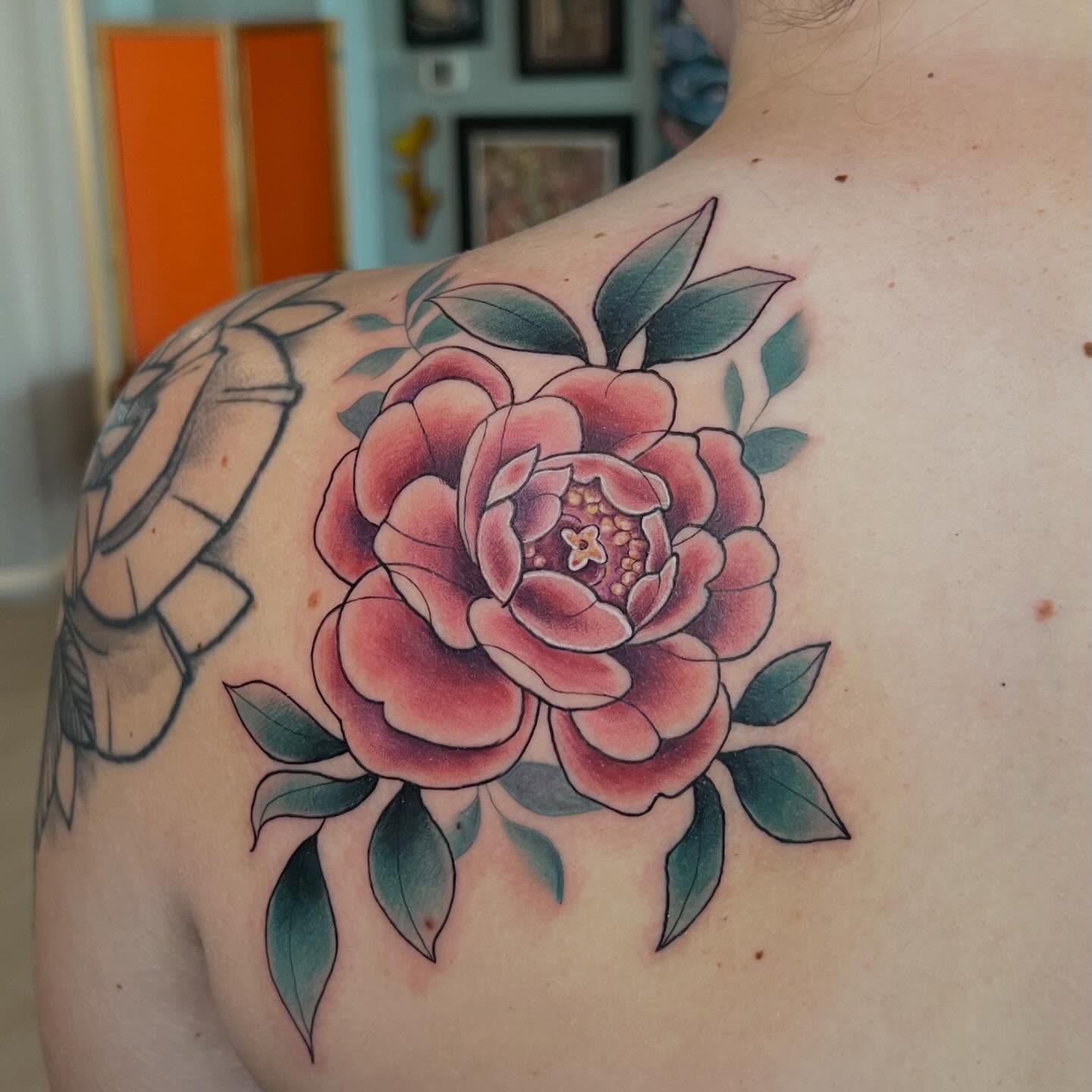 Peony American traditional tattoo on the shoulder by Jessica Kloos