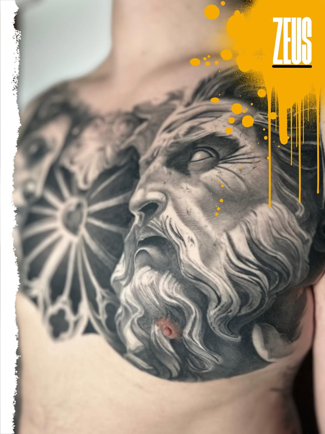 Zeus portrait with stained glass window surrealism tattoo on the chest by Eltche Art Tattoo