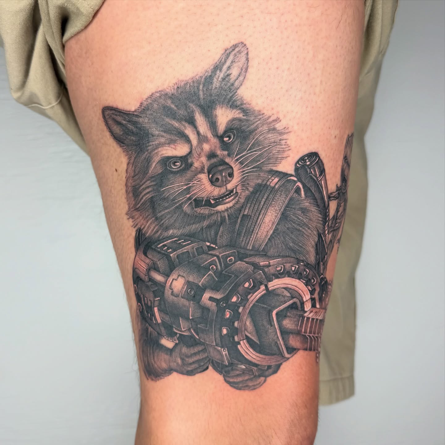 Rocket raccoon realism tattoo on the thigh by Rose