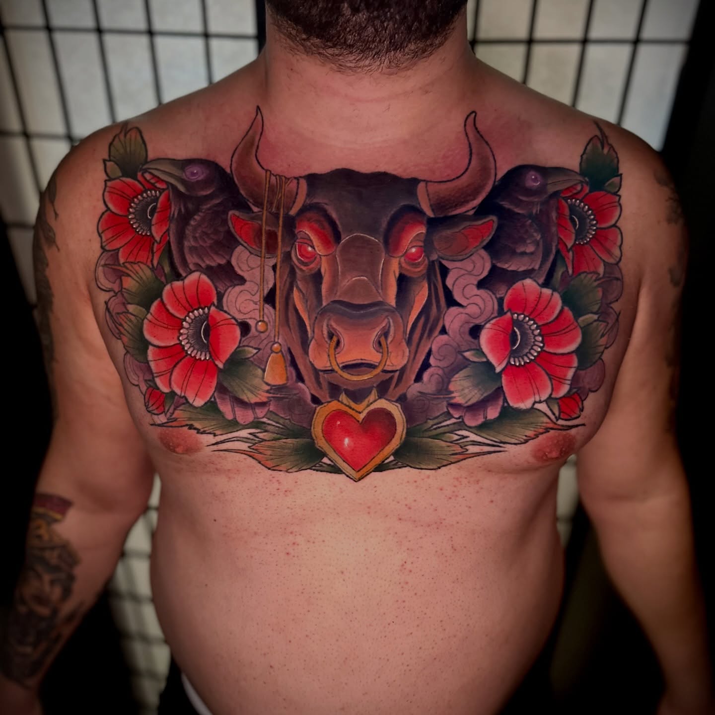 Bull and flowers American traditional tattoo on the chest by Robert Douglas
