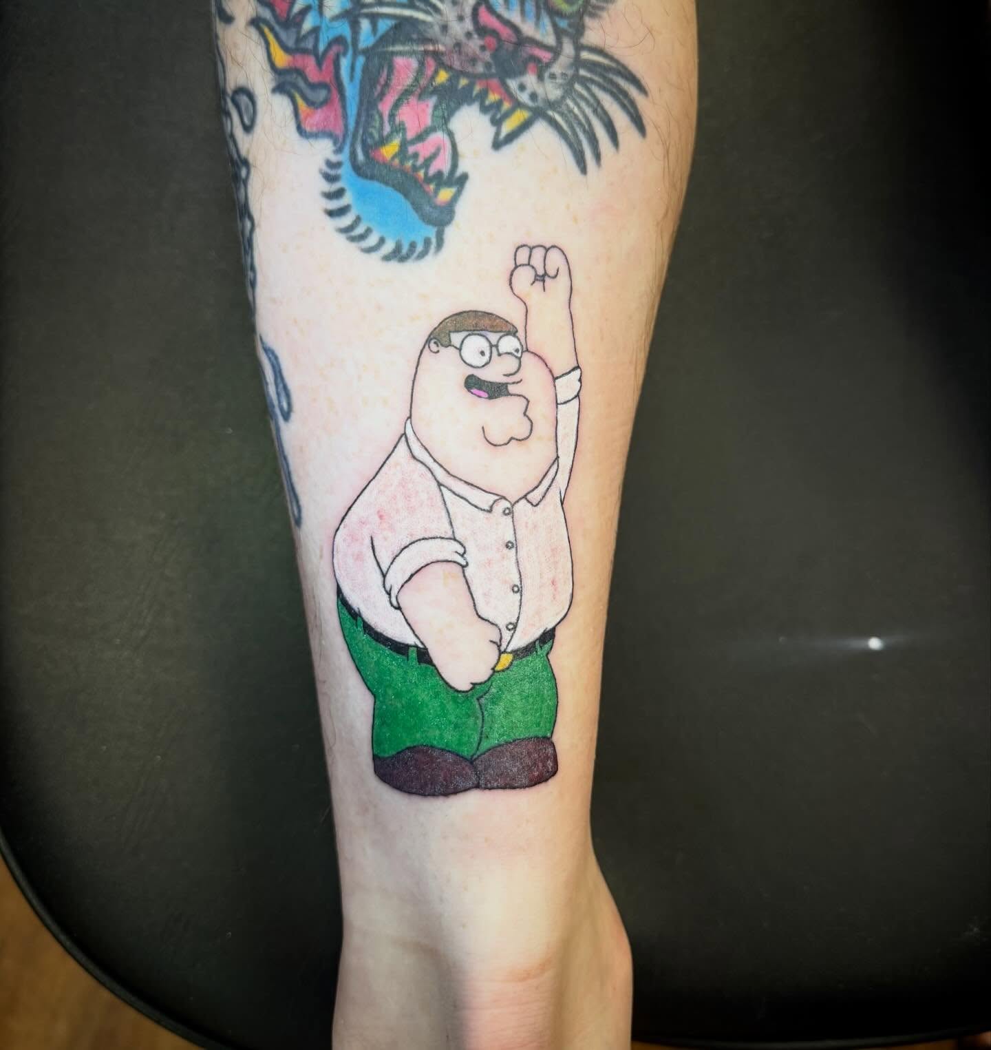 Peter Griffin new school tattoo on the forearm by Mikey