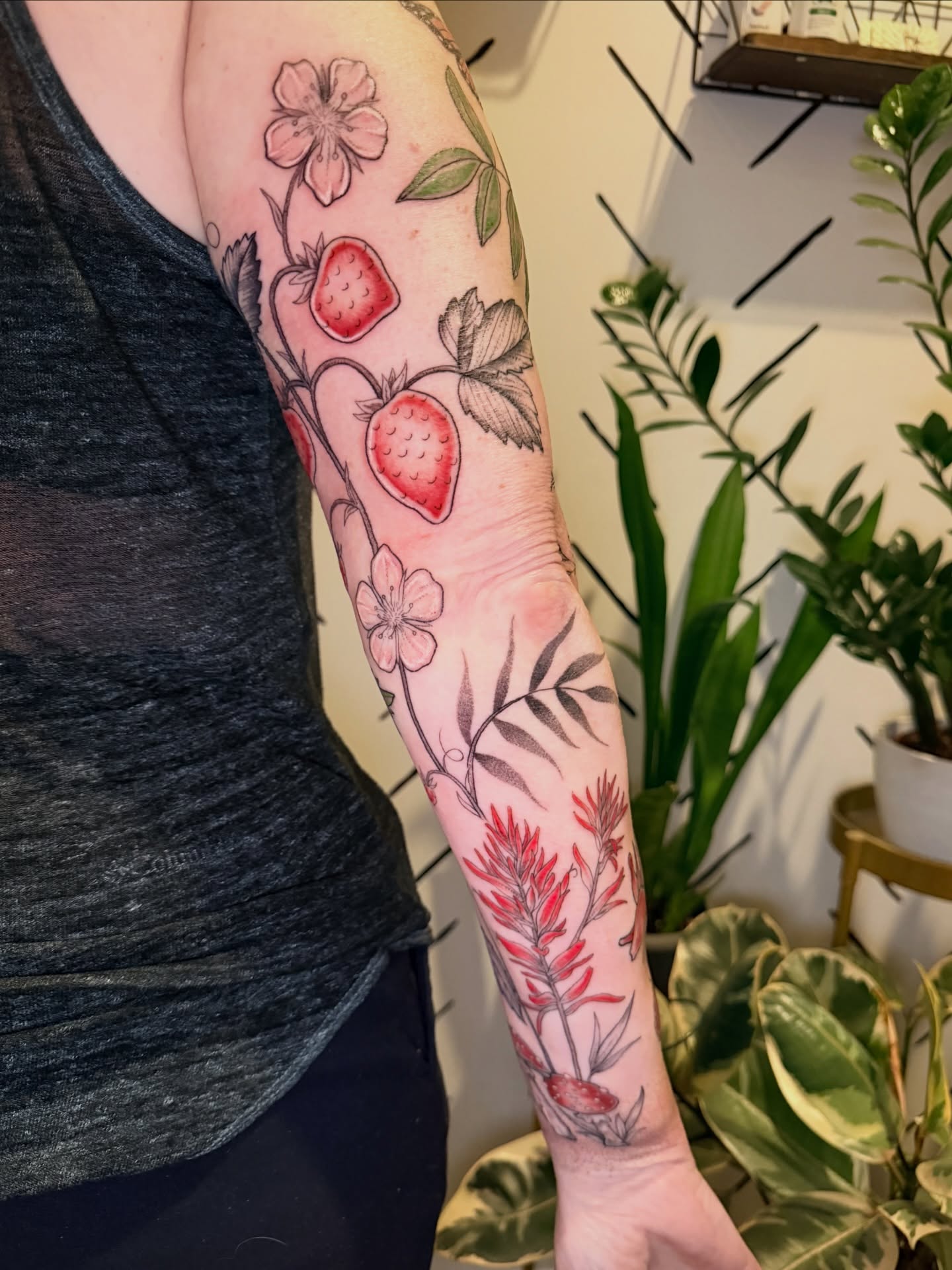 Strawberry and floral realism tattoo on the forearm by ππ£ππ€π₯π ππ¦ππ‘π, Lakewood, Colorado