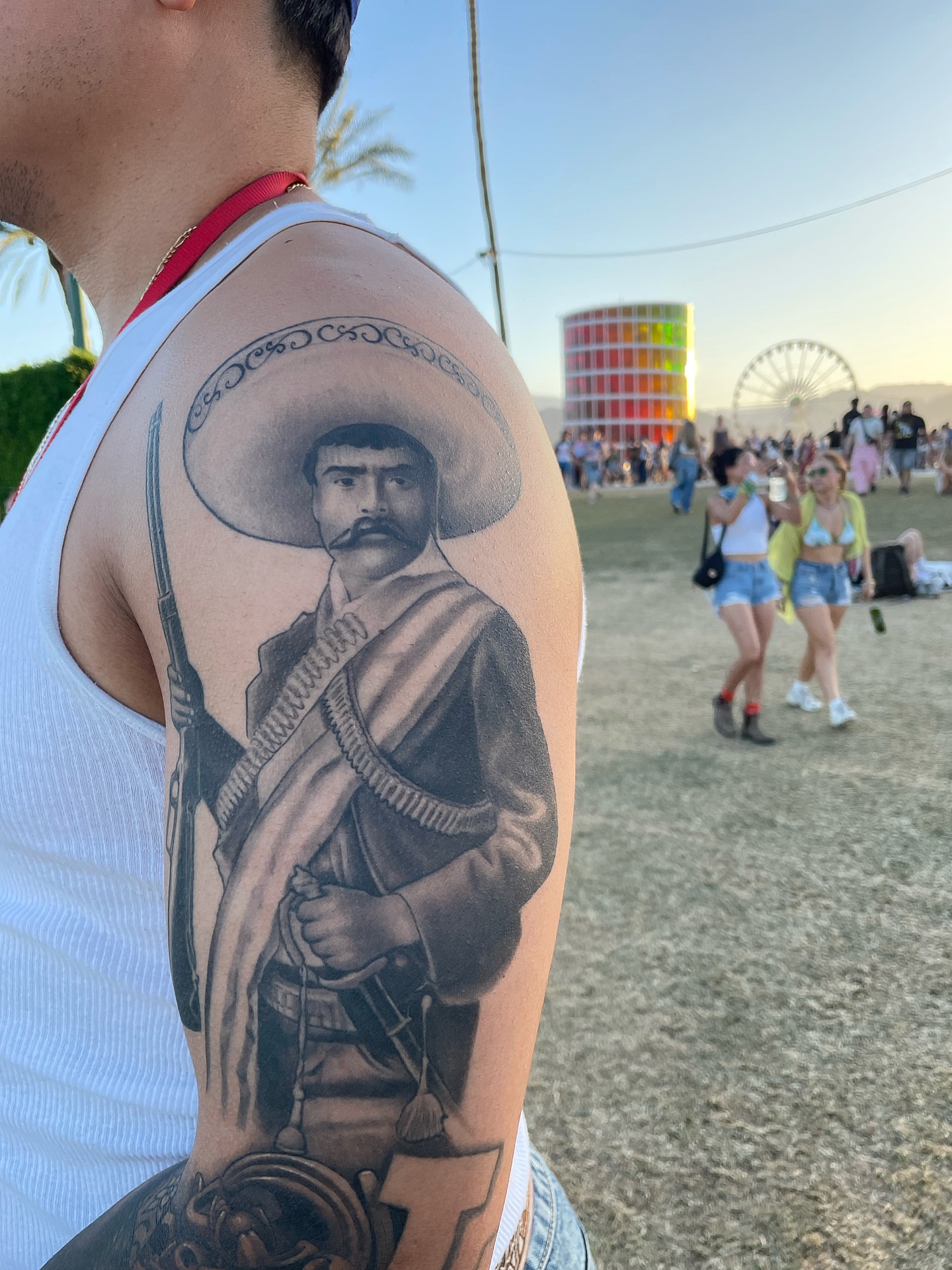 Revolutionary figure black and grey tattoo on the upper arm by Alex Ortiz