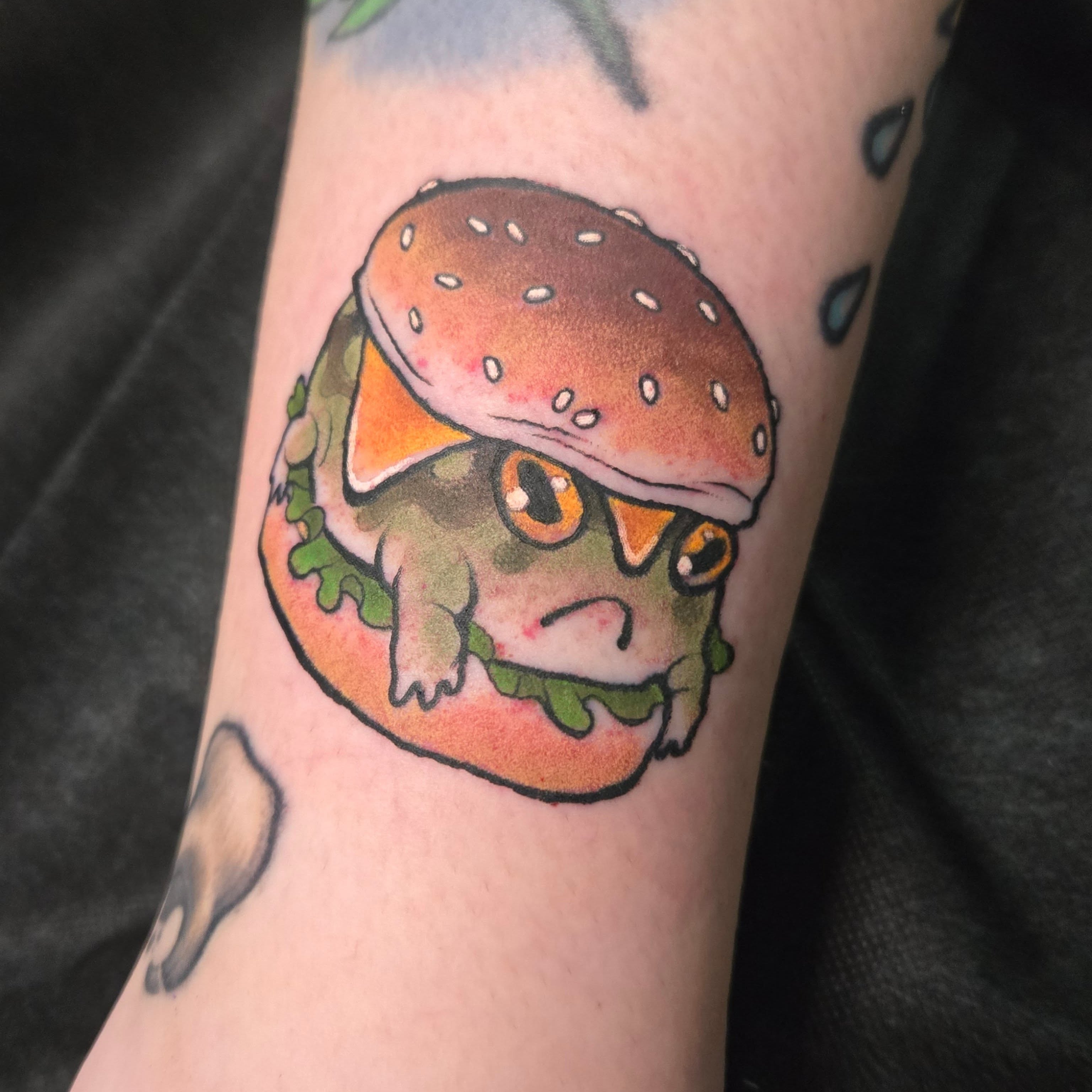 Frog burger new school tattoo on the forearm by ◇  Kristyn Kay  ◇ Tattoo Warlock, Des Moines, Iowa