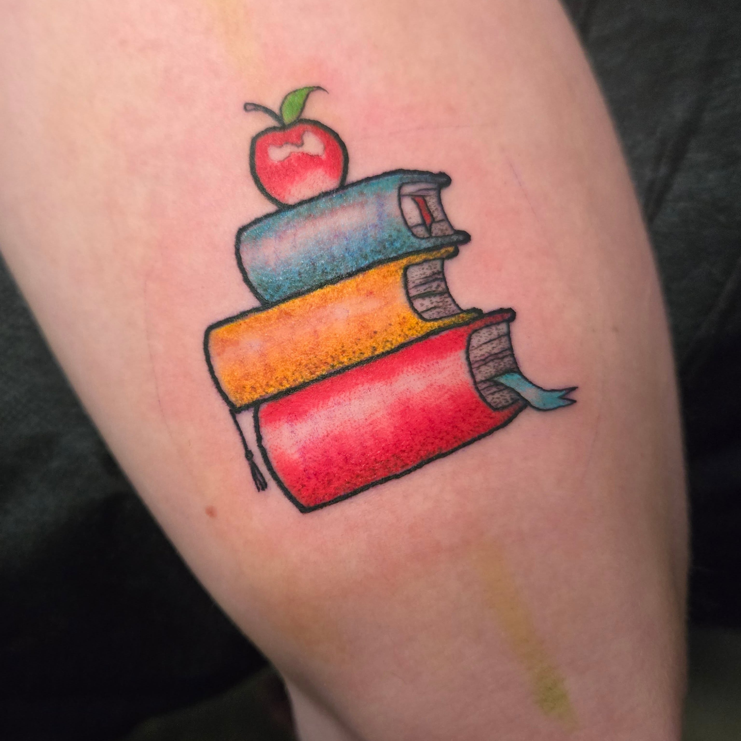 Stack of books with apple dotwork tattoo on the forearm by ◇  Kristyn Kay  ◇ Tattoo Warlock, Des Moines, Iowa