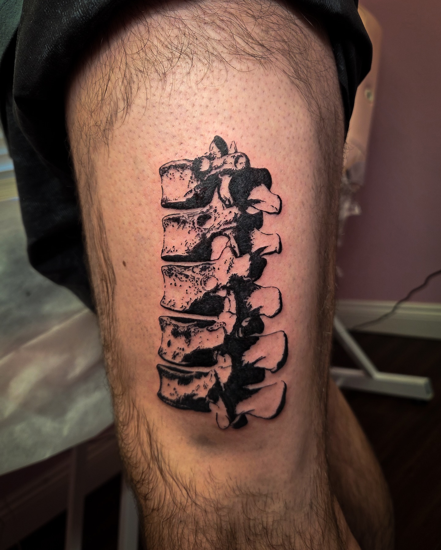 Spine black and grey tattoo on the thigh by Tattoo Artist X Kamm, Salt Lake City, Utah
