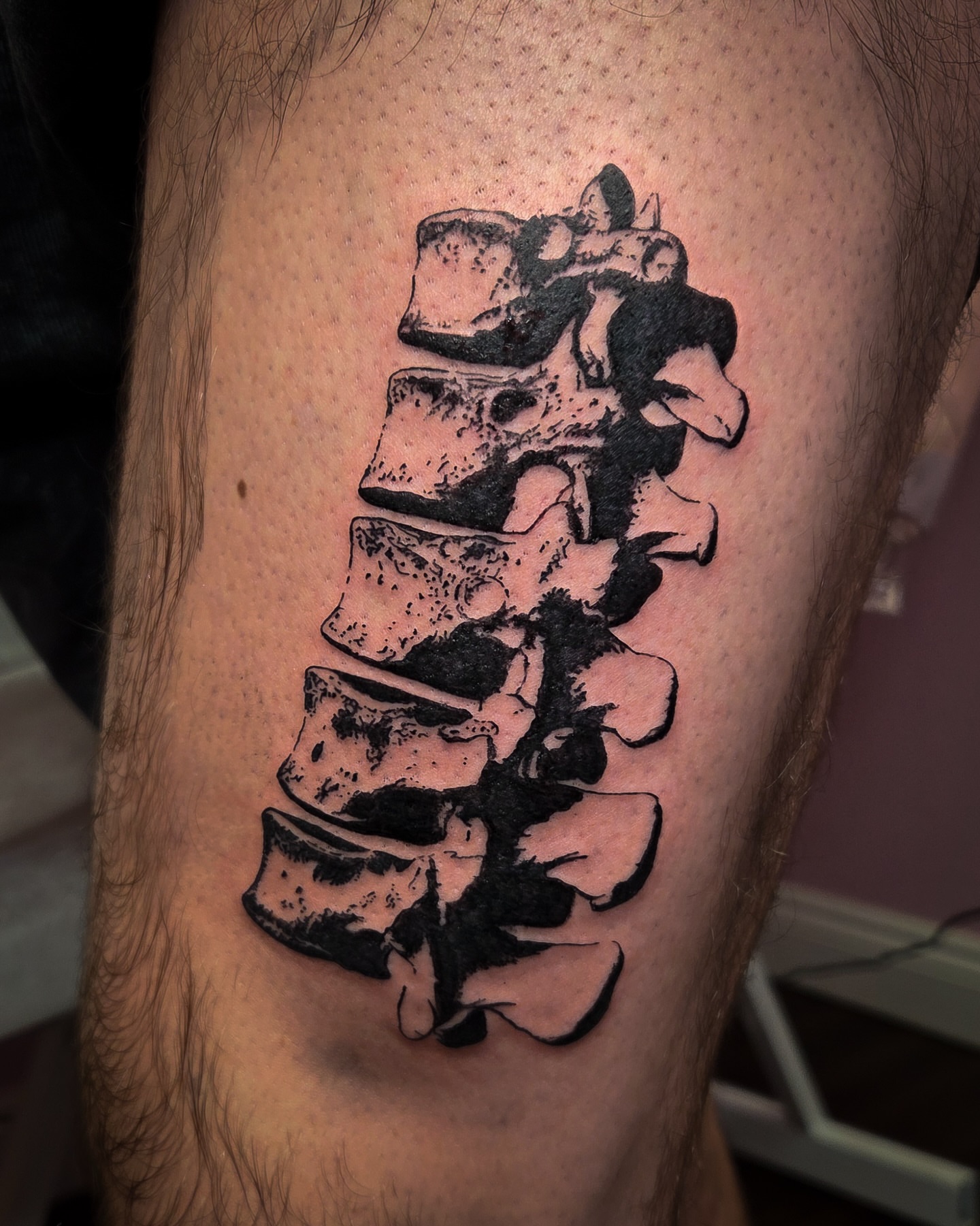 Spine black and grey tattoo on the thigh by Tattoo Artist X Kamm, Salt Lake City, Utah