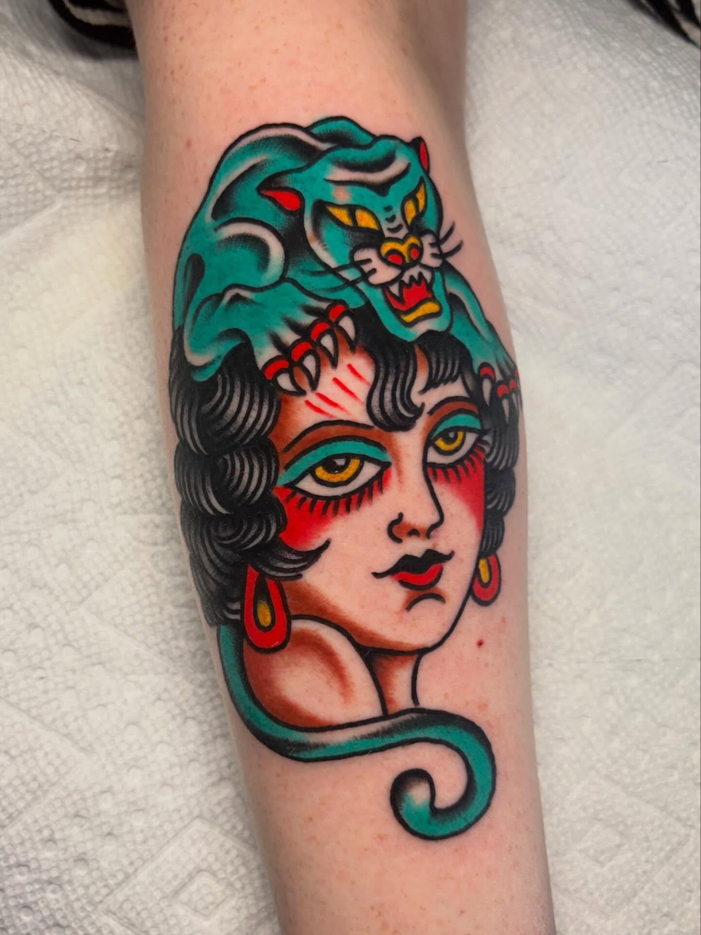 Woman with cat American traditional tattoo on the forearm by David Armacost, Cincinnati, Ohio