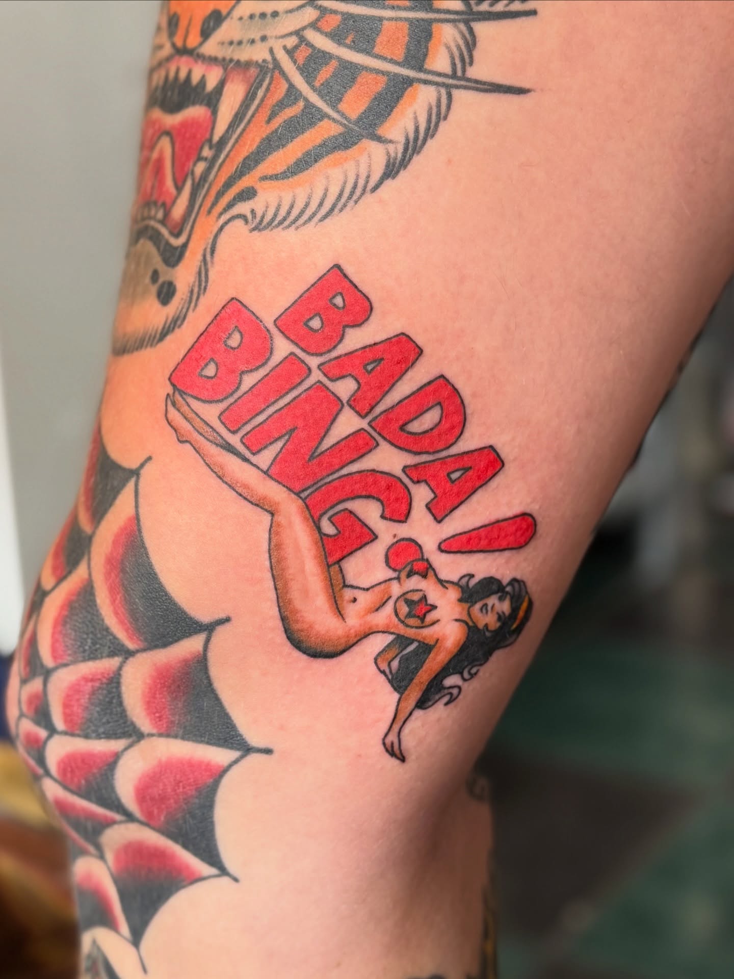 Bada bing pin-up girl American traditional tattoo on the forearm by Devin Derbes