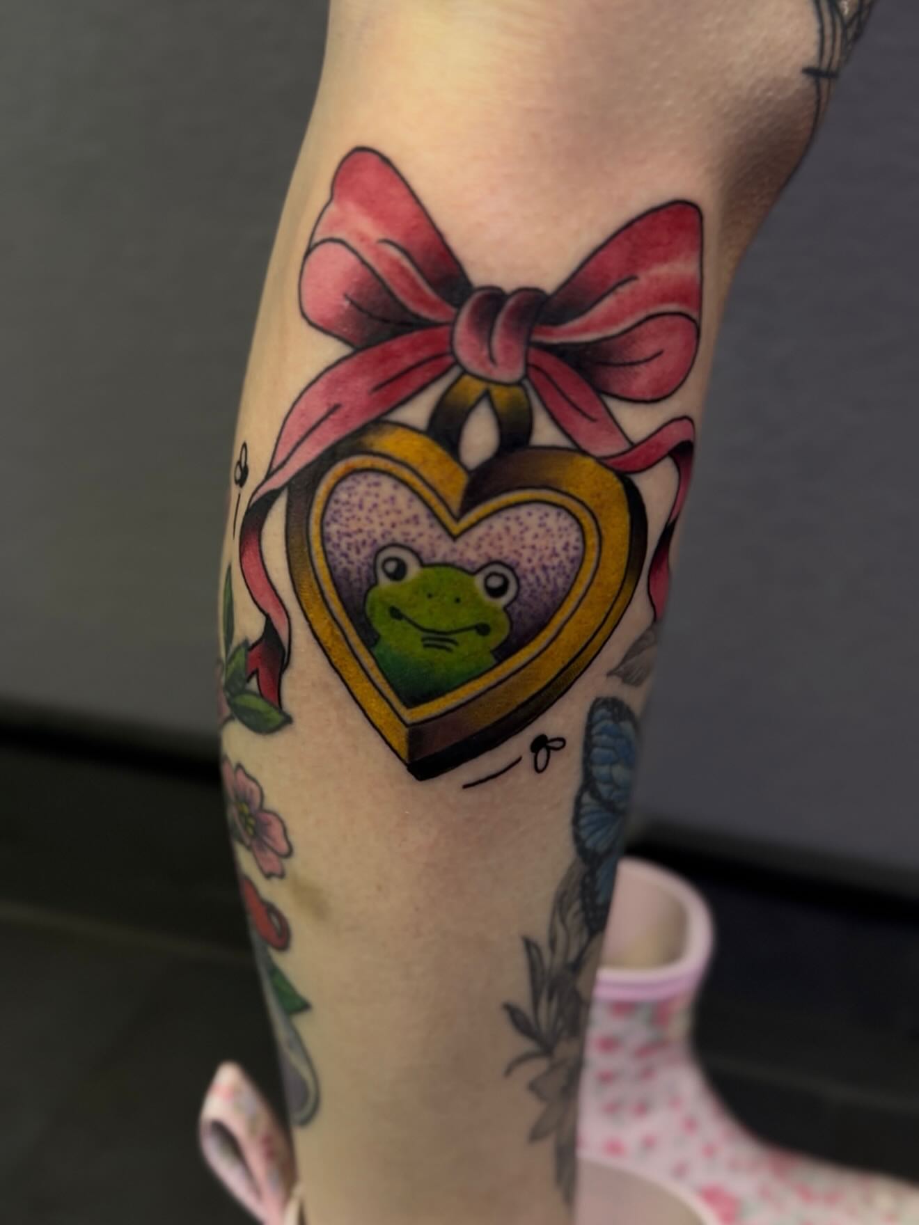 Frog in heart box American traditional tattoo on the forearm by H.G