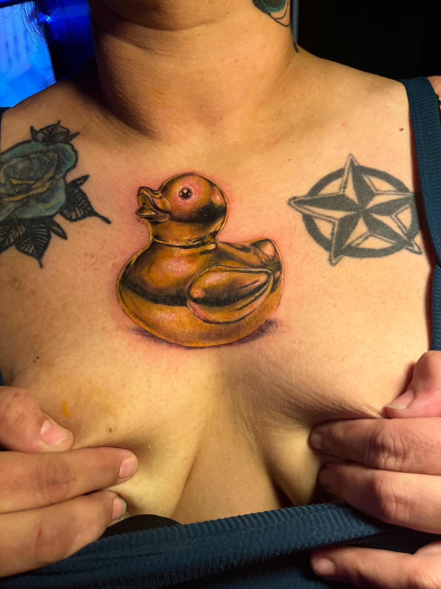 Rubber duck realism tattoo on the chest by Christa Martinez