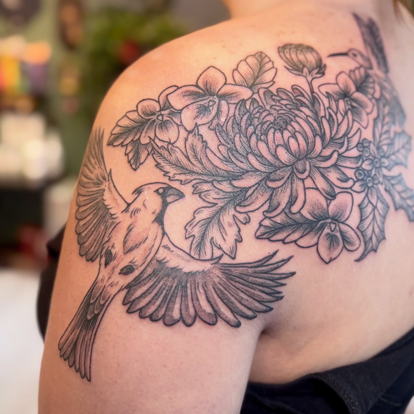 Birds and flowers black and grey tattoo on the shoulder by Meg Ingersoll