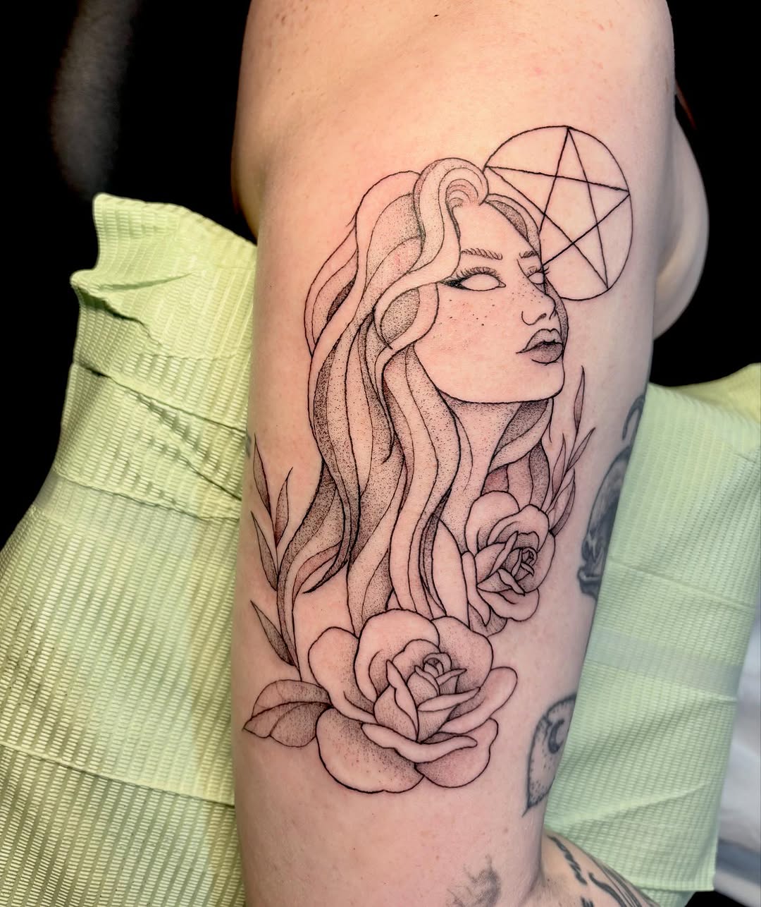Woman with roses and pentagram realism tattoo on the forearm by madison, Cincinnati
