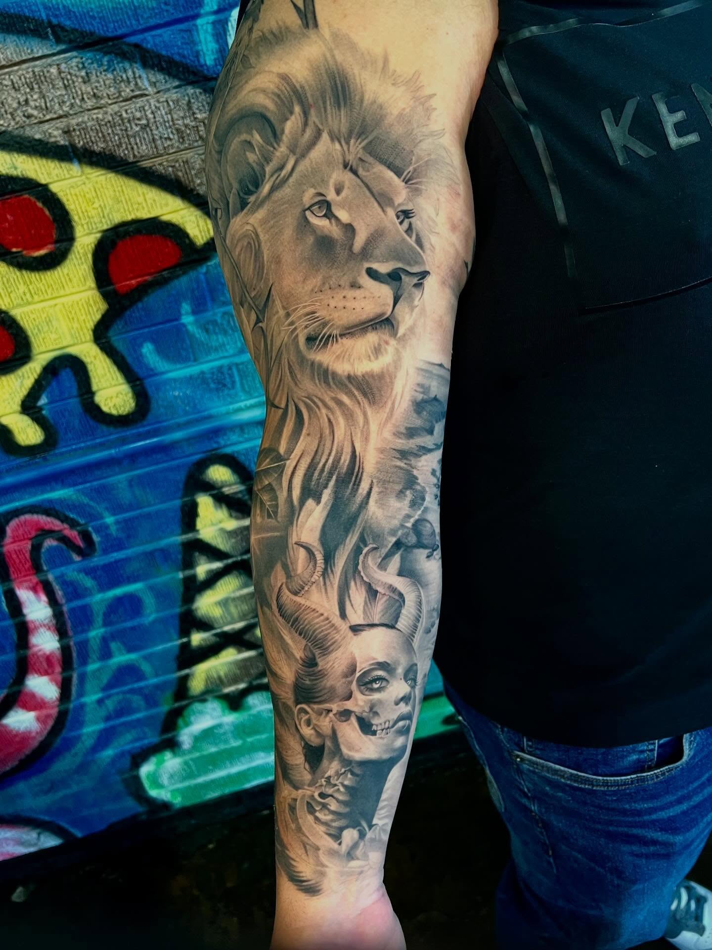 Lion and woman realism tattoo on the forearm by Joi Bailey, Denton, Texas