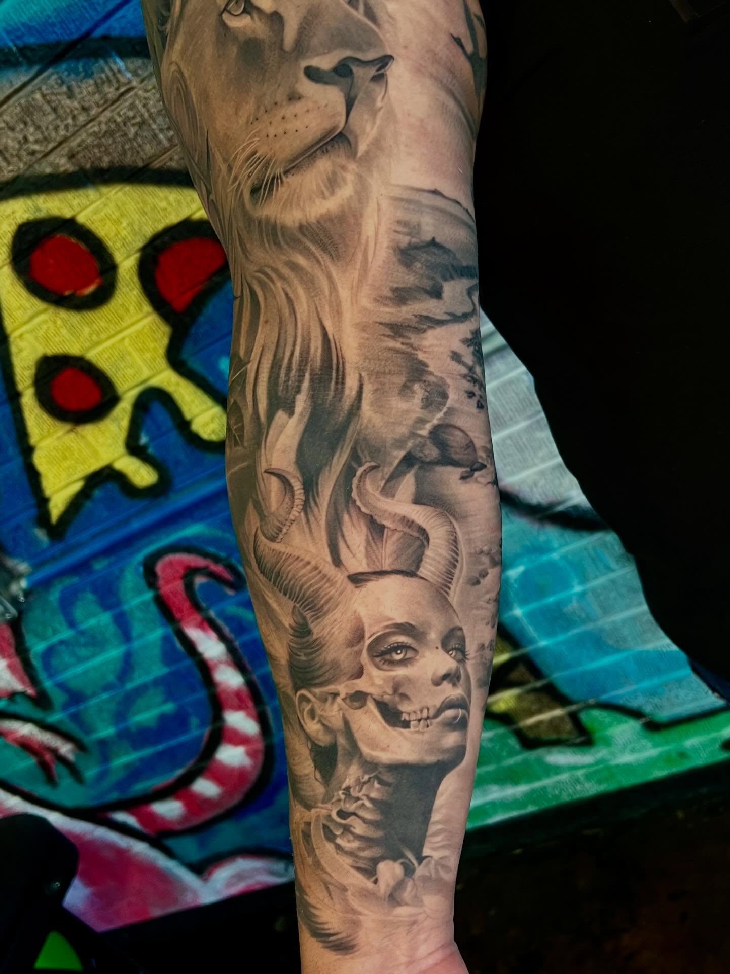 Lion and woman realism tattoo on the forearm by Joi Bailey, Denton, Texas