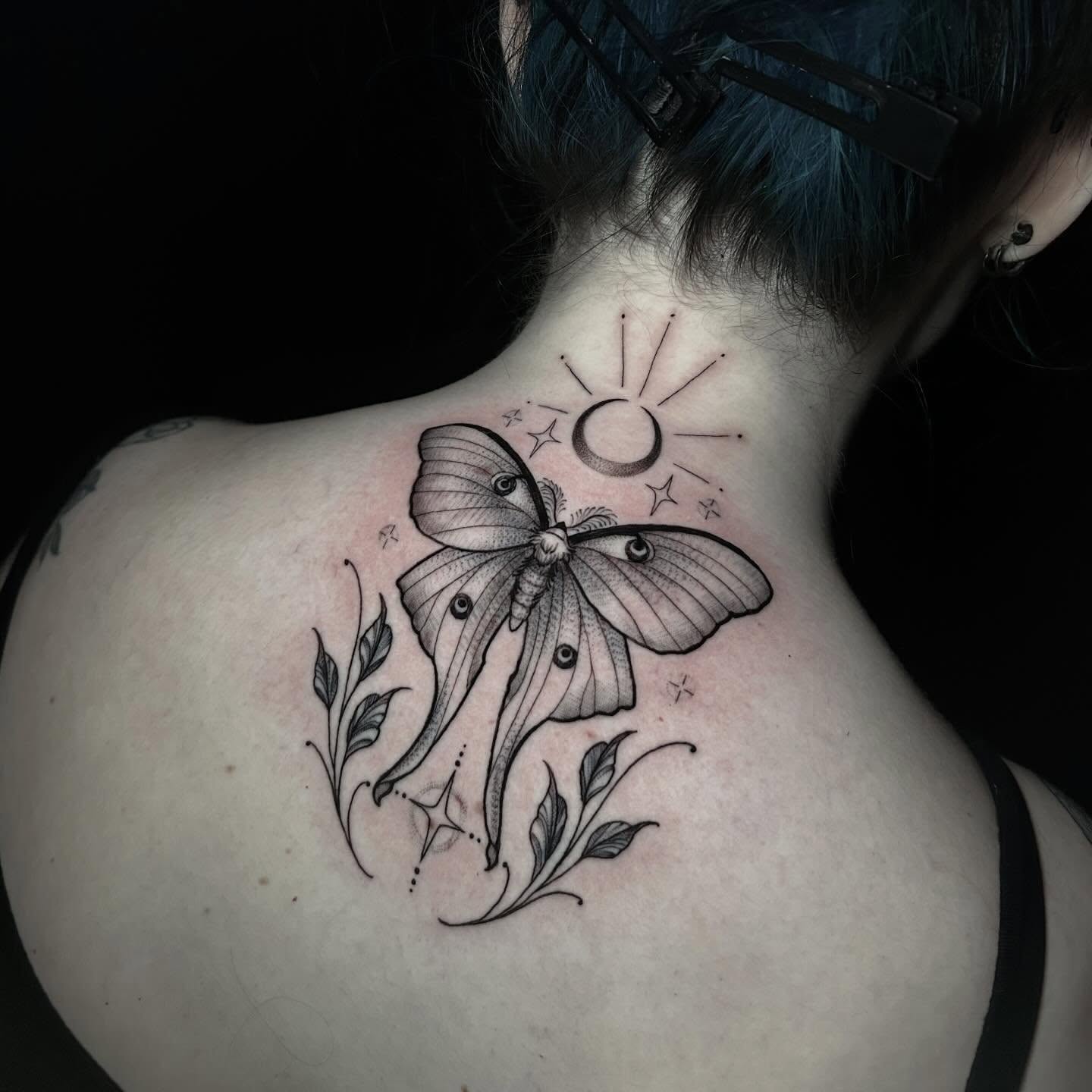 Moth and floral realism tattoo on the neck by Ashlee Mshar