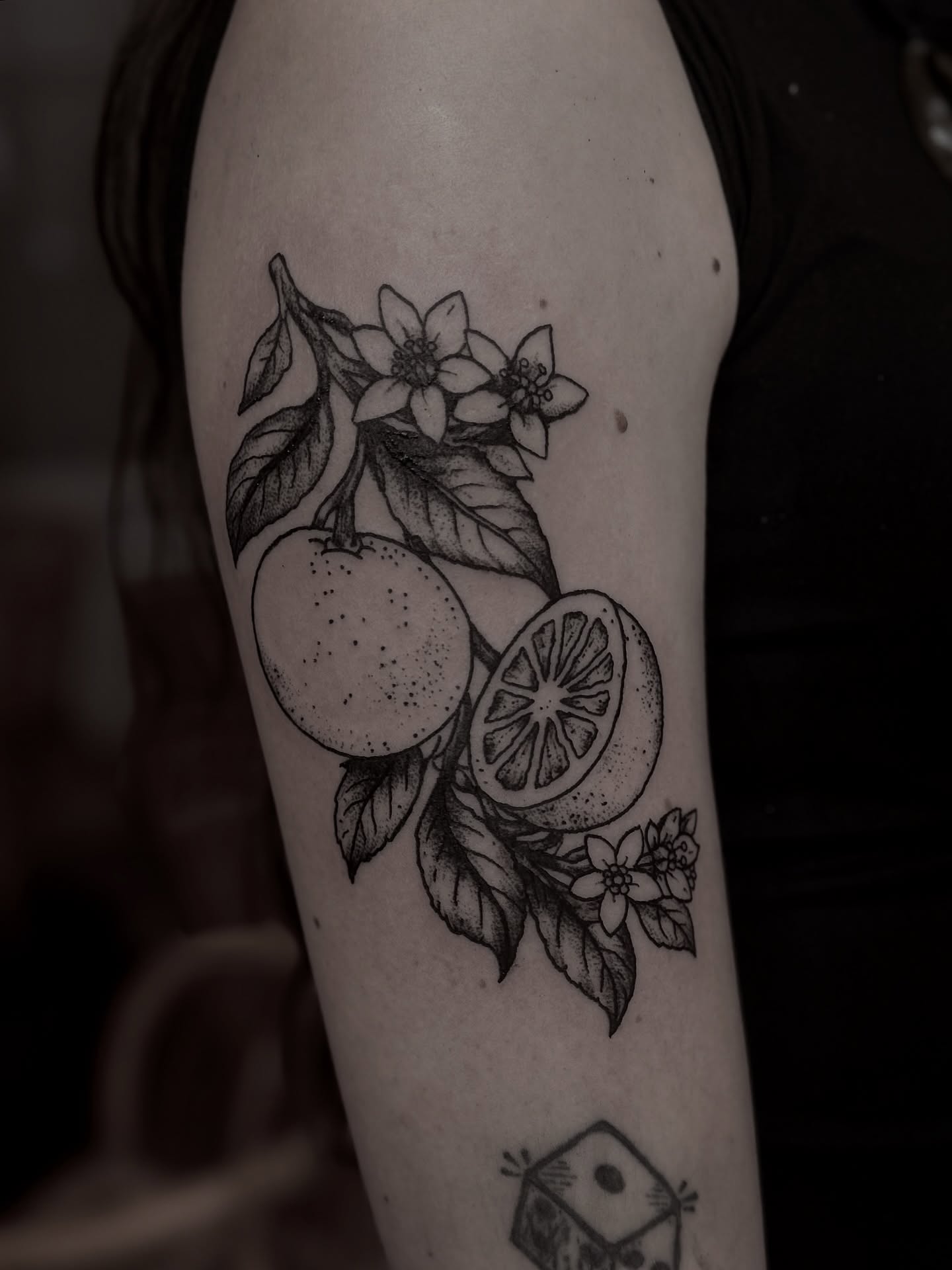 Orange and flowers dotwork tattoo on the forearm by Tattoo Artist, Philadelphia, Pennsylvania