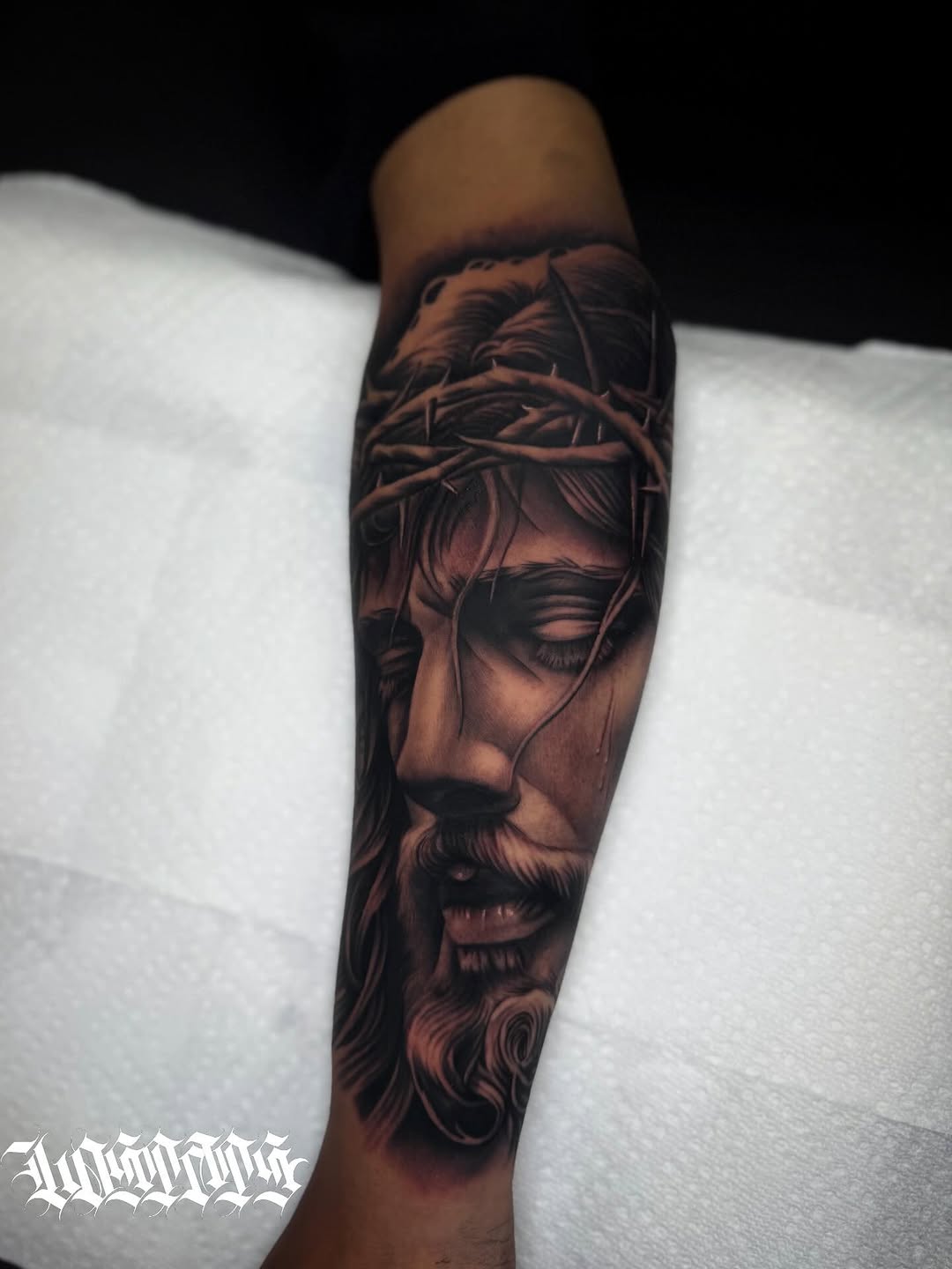 Jesus Christ portrait Chicano tattoo on the forearm by LOS