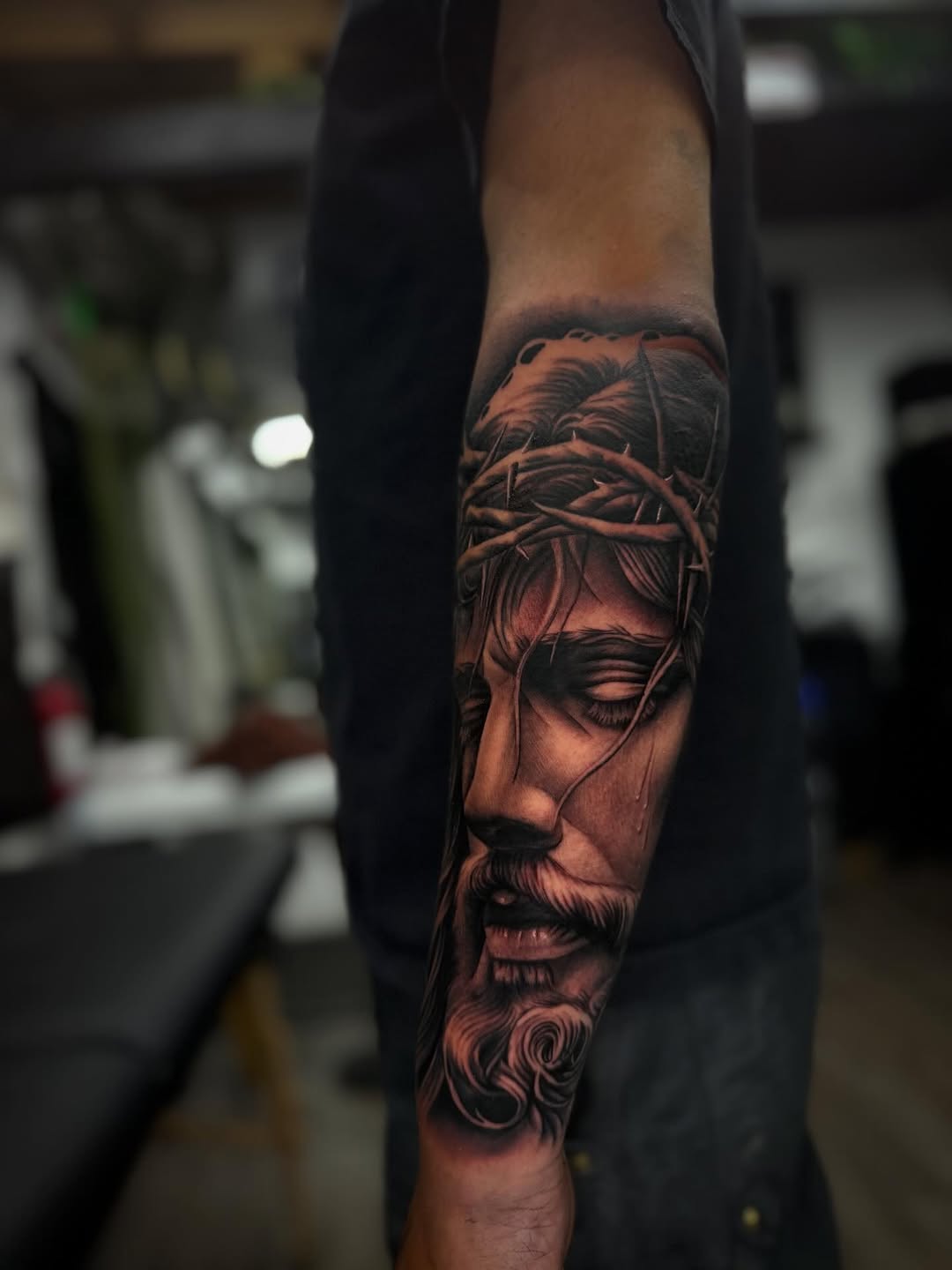 Jesus Christ portrait Chicano tattoo on the forearm by LOS
