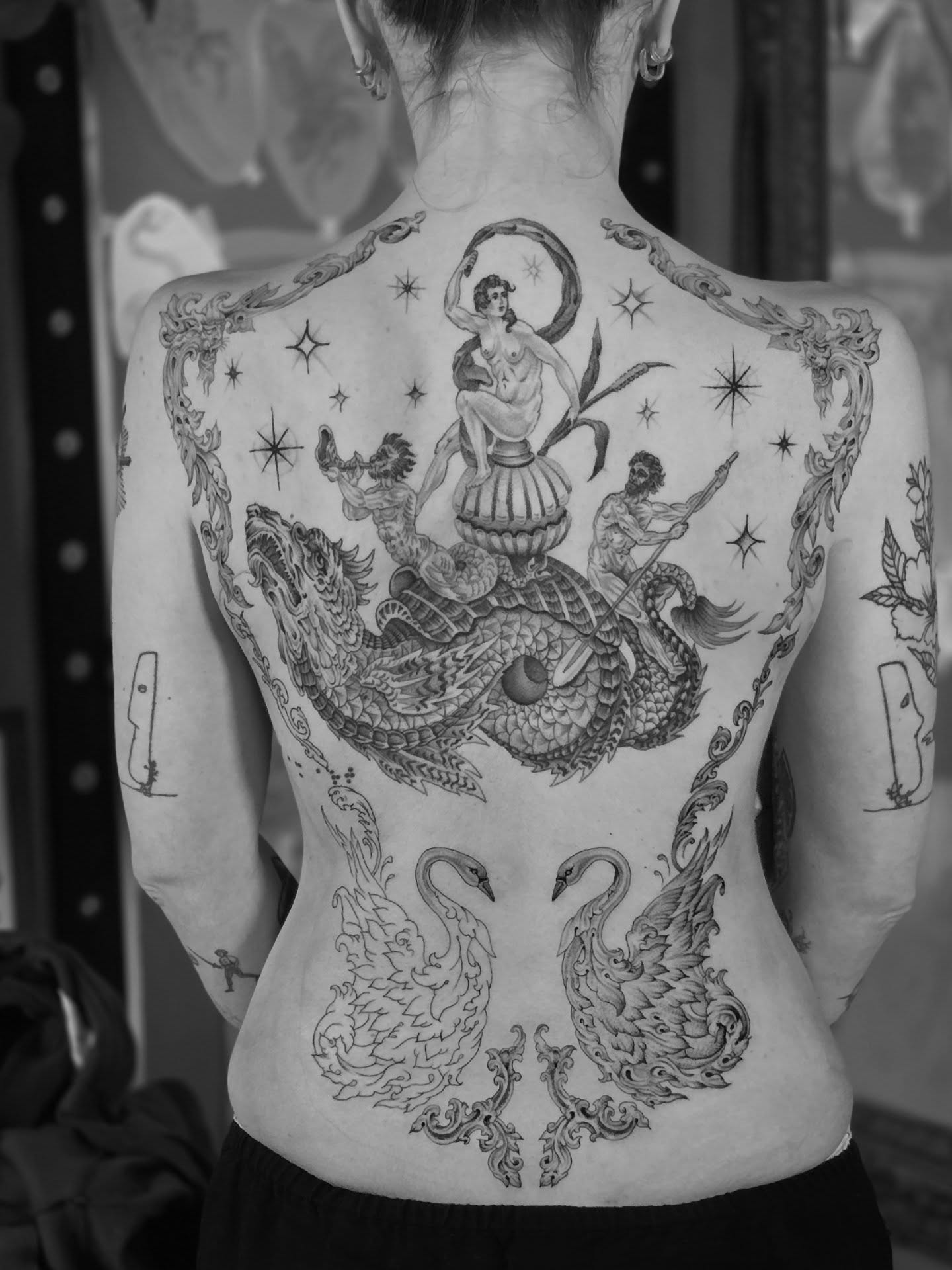 Mythical creature and woman ornamental tattoo on the back by Aaron Dor