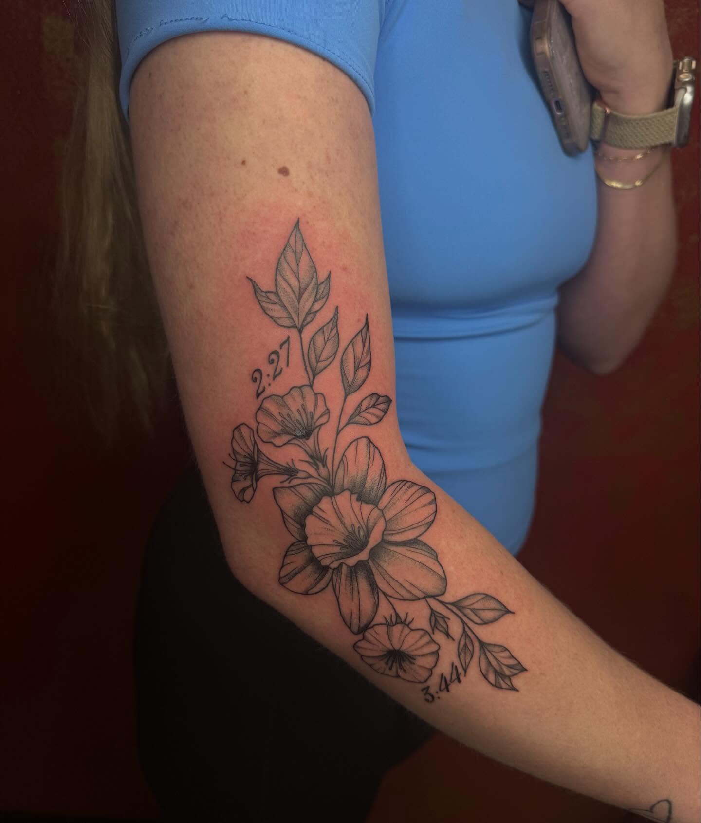 Floral arrangement black and grey tattoo on the forearm by Imani