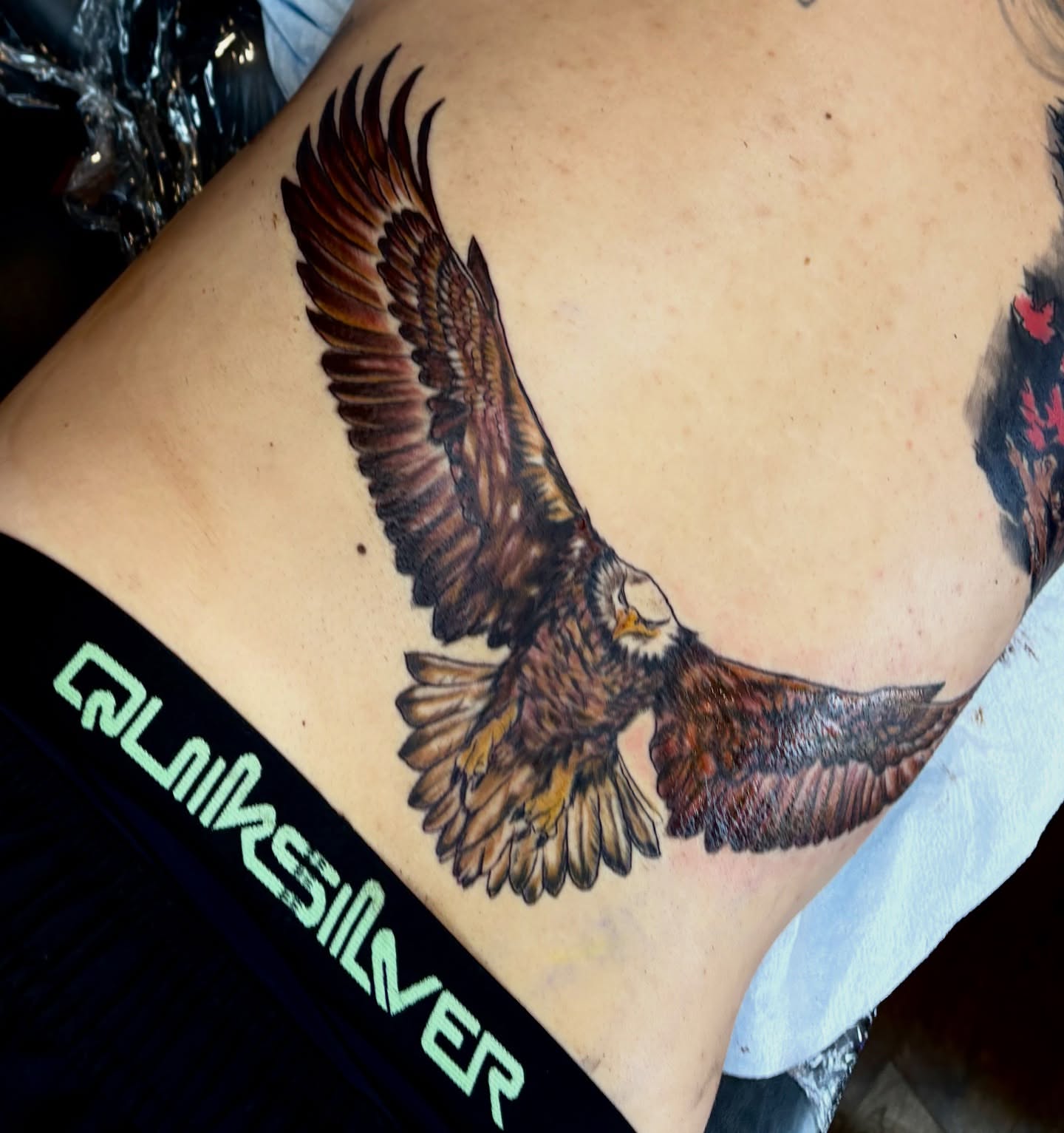 Eagle realism tattoo on the ribs by Butz Tattoos