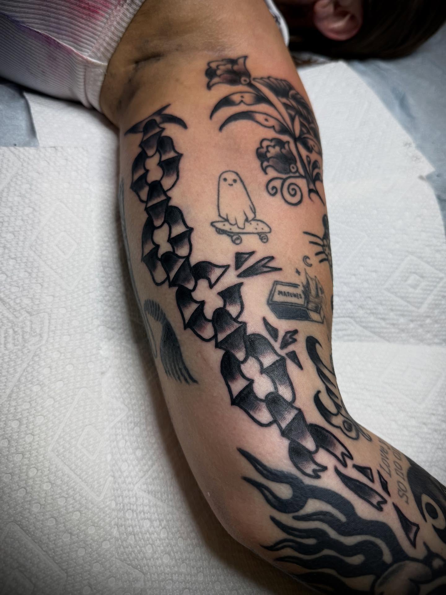 Ghost and skateboard black and grey tattoo on the forearm by Victoria Lagano NYC Traditional Tattoos