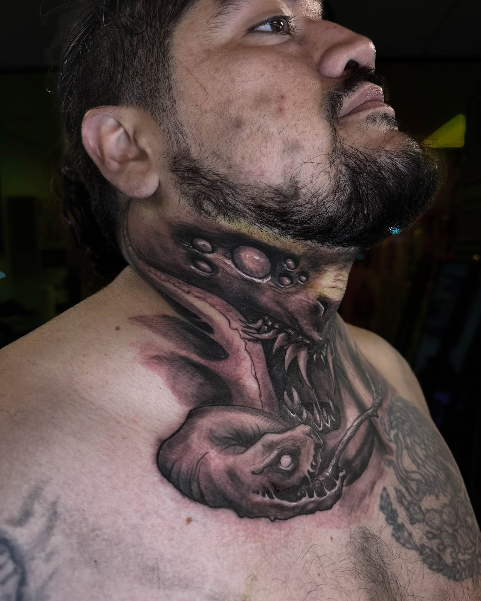 Monster dark realism tattoo on the neck by Bruno Moretti
