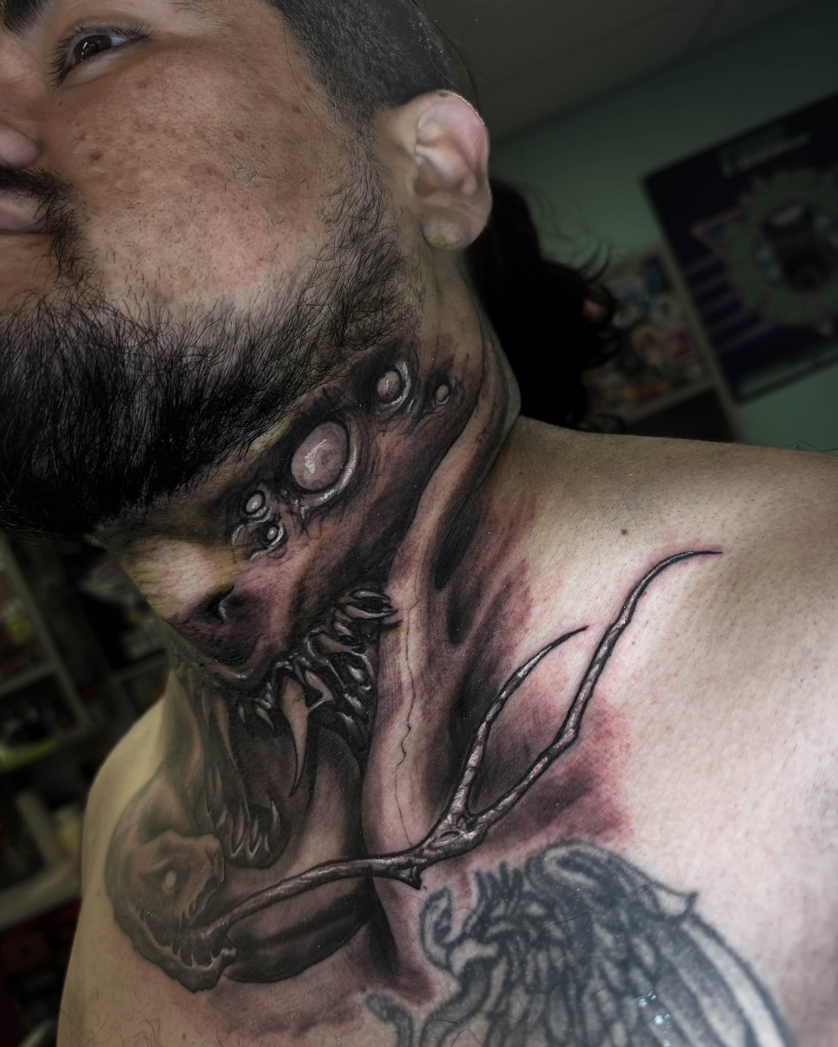Monster dark realism tattoo on the neck by Bruno Moretti