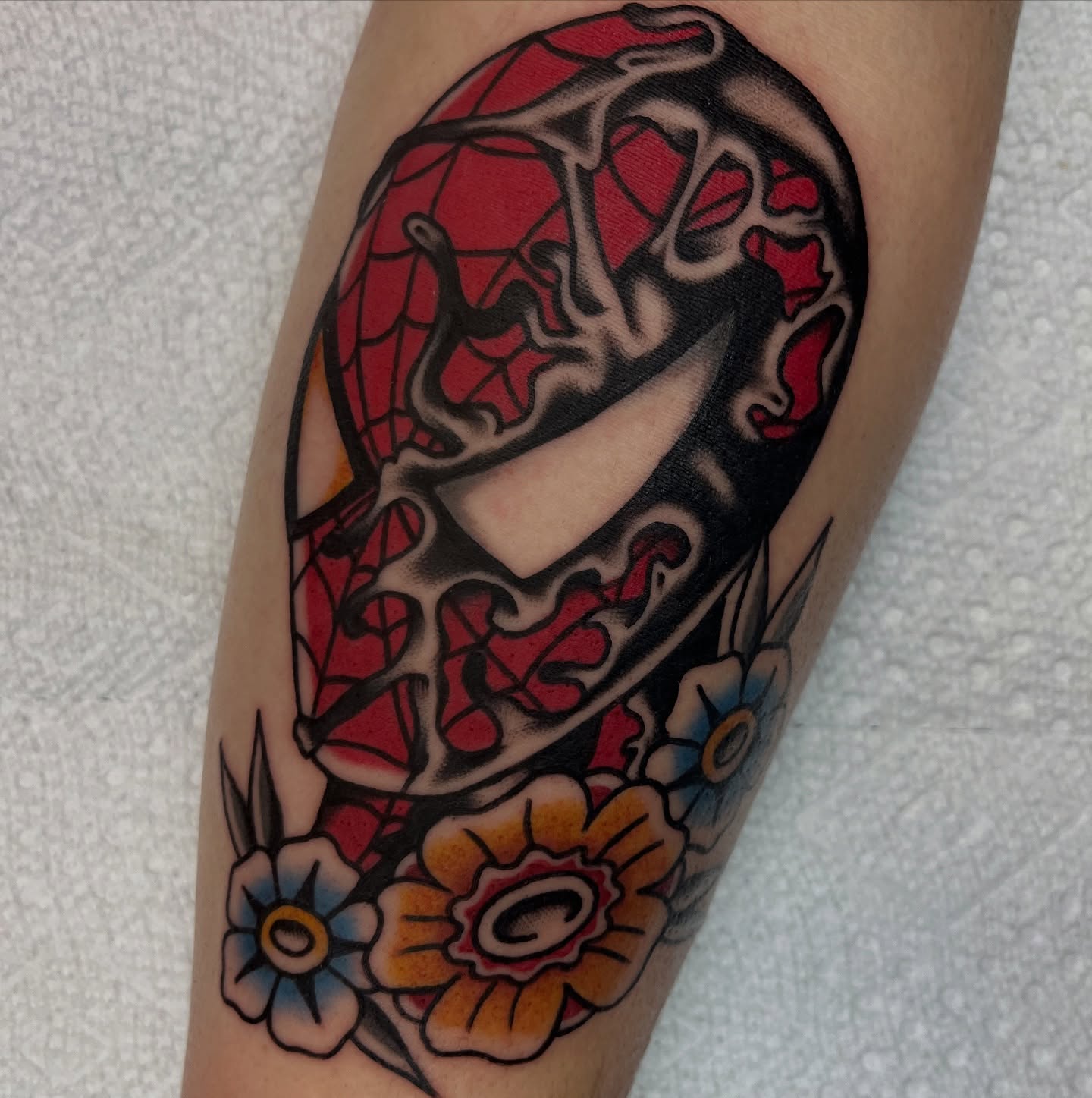 Spider and flowers American traditional tattoo on the forearm by August B., Renton, Washington