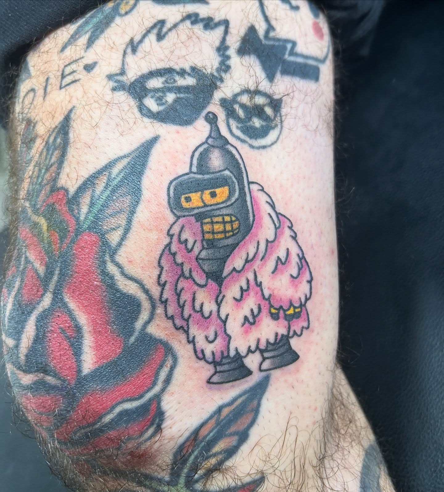 Robot in fur coat American traditional tattoo on the forearm by Tawni Bender