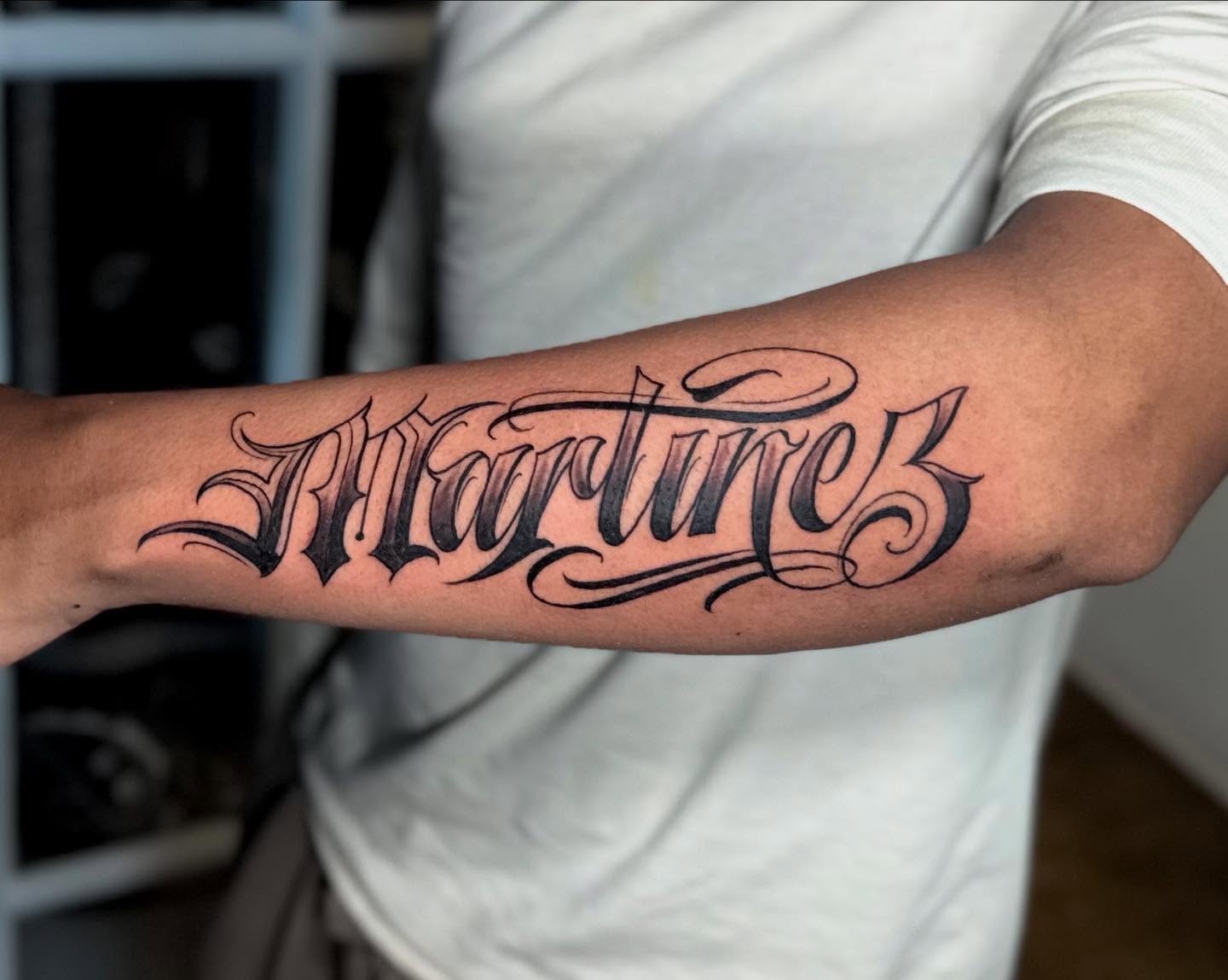 Martinez lettering script tattoo on the forearm by Stilow Memphis Tattoo Artist, Memphis, Tennessee