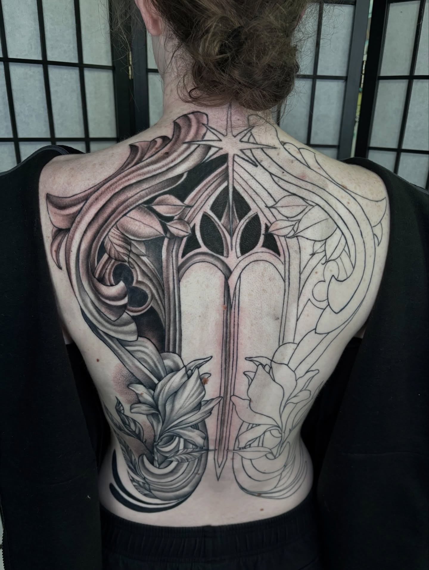 Gothic window ornamental tattoo on the back by hannah vertal