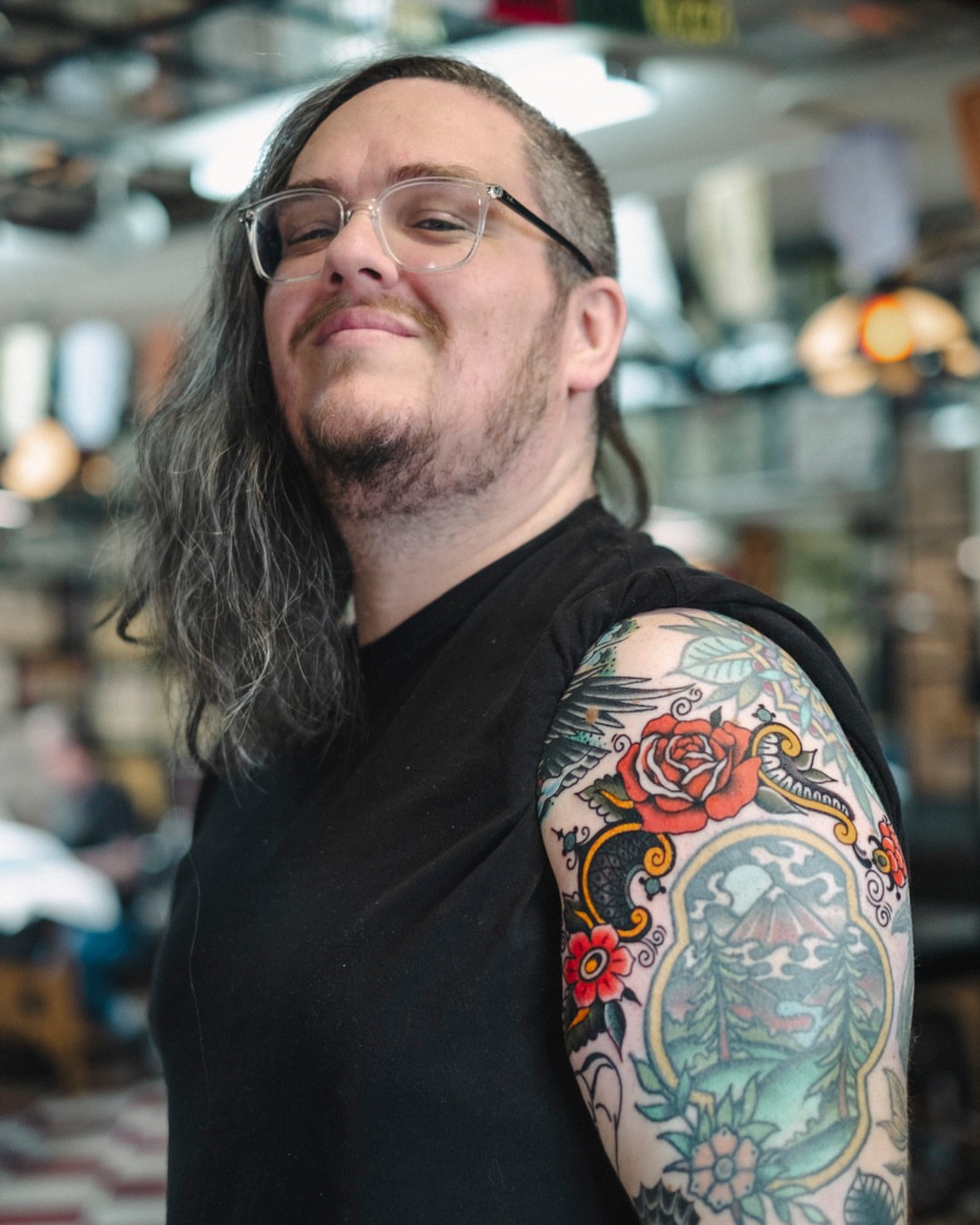 Floral landscape American traditional tattoo on the upper arm by Dan Gilsdorf, Portland, Oregon