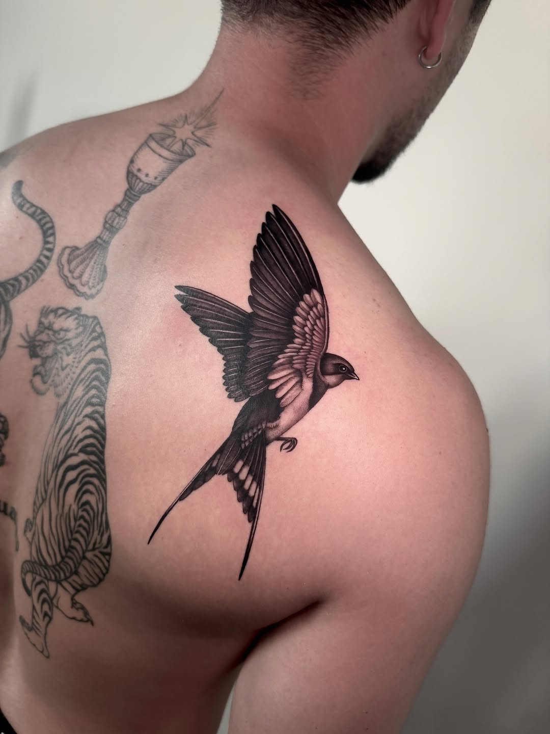 Tattoo by @nizi_tattoo — realism, black_and_grey