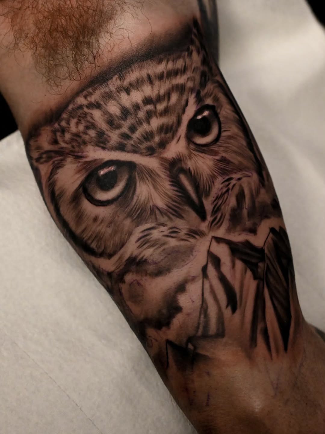 Owl realism tattoo on the forearm by Michael ORegan