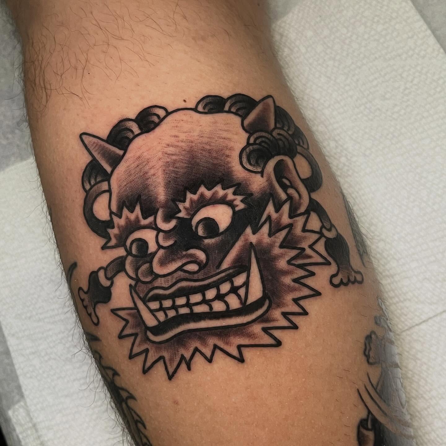Demon mask American traditional tattoo on the forearm by Rizzo