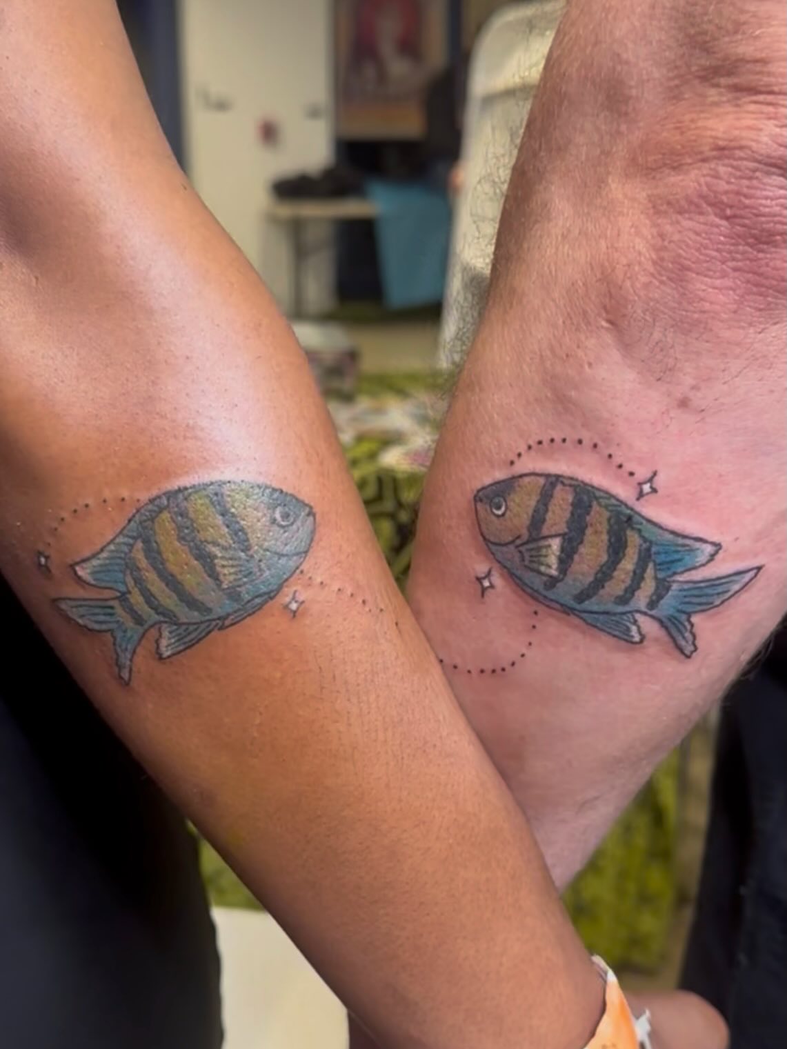 Striped fish dotwork tattoo on the forearm by Zen Forbes