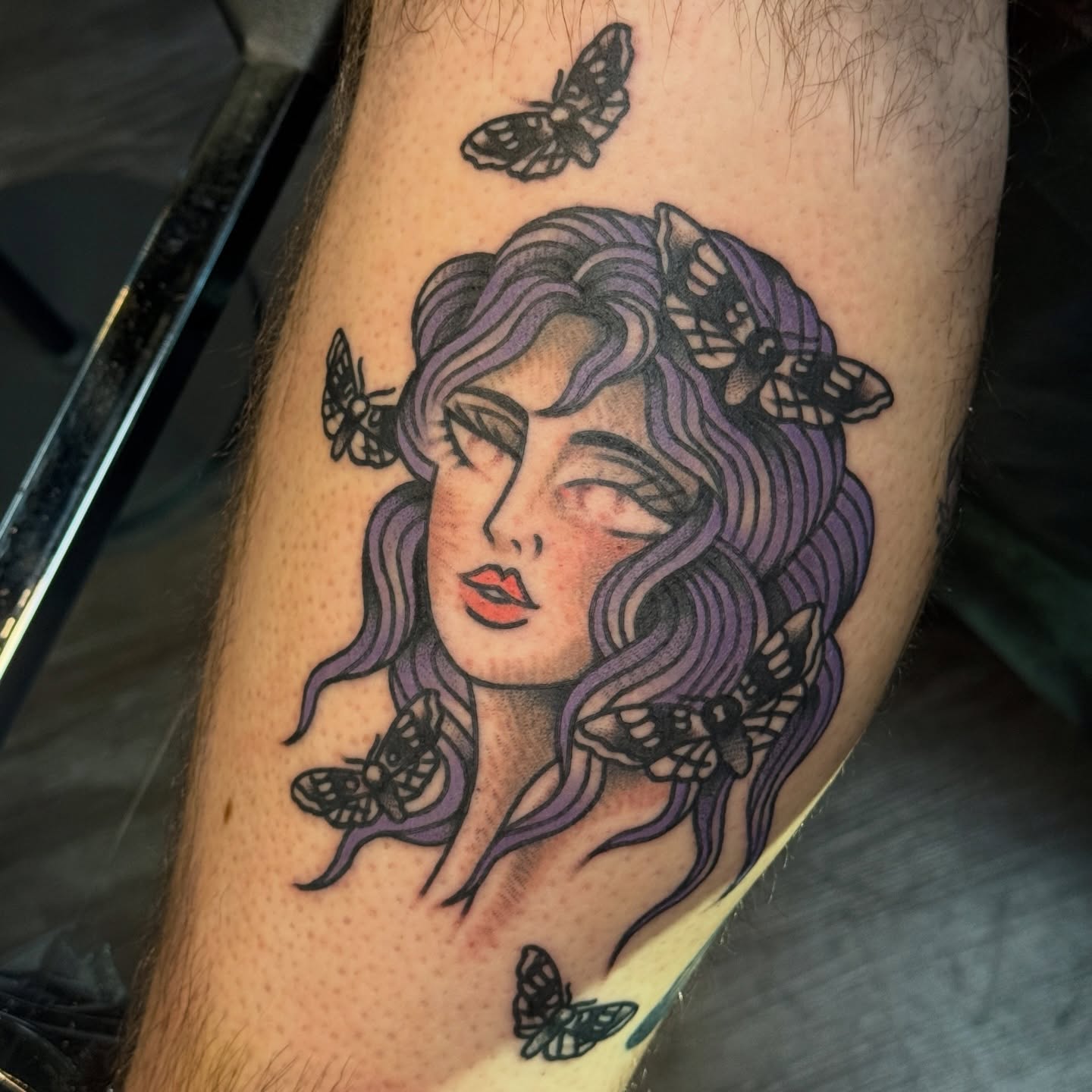 Woman with butterflies American traditional tattoo on the forearm by Traddy Maddie ๐