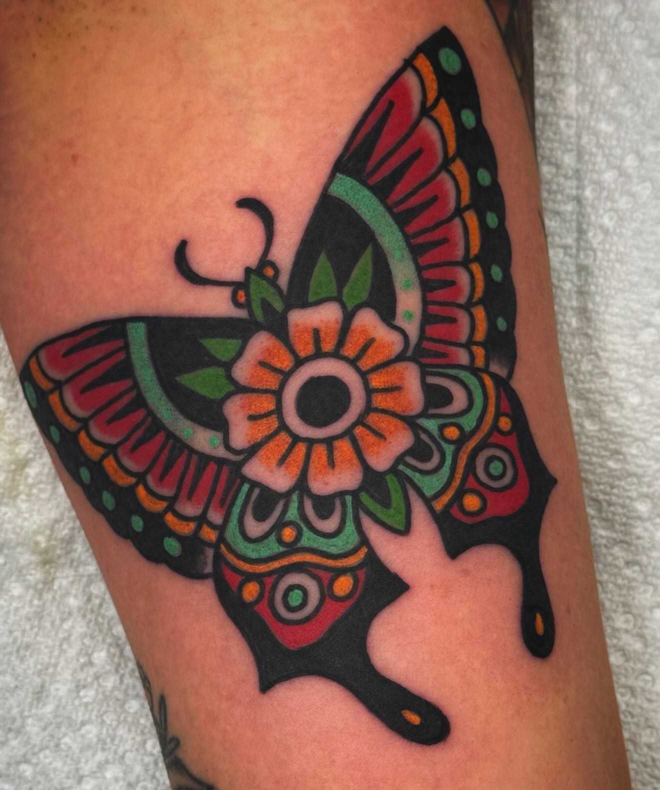 Butterfly American traditional tattoo on the forearm by Mikey Sarratt