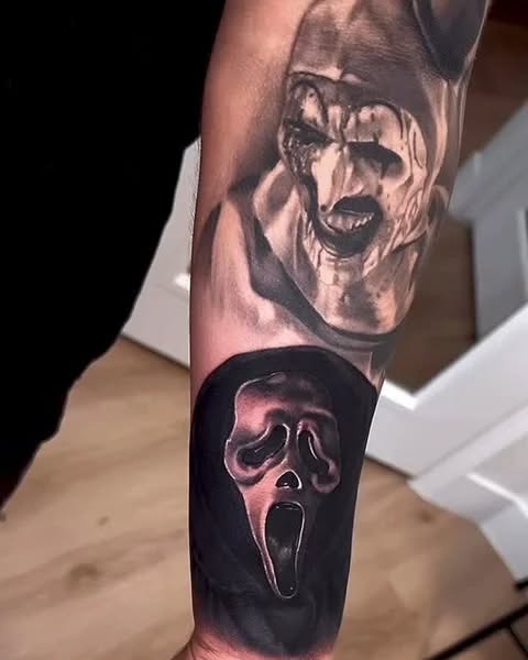 Art the Clown and Ghostface mask realism tattoo on the forearm by Magdalena Davis