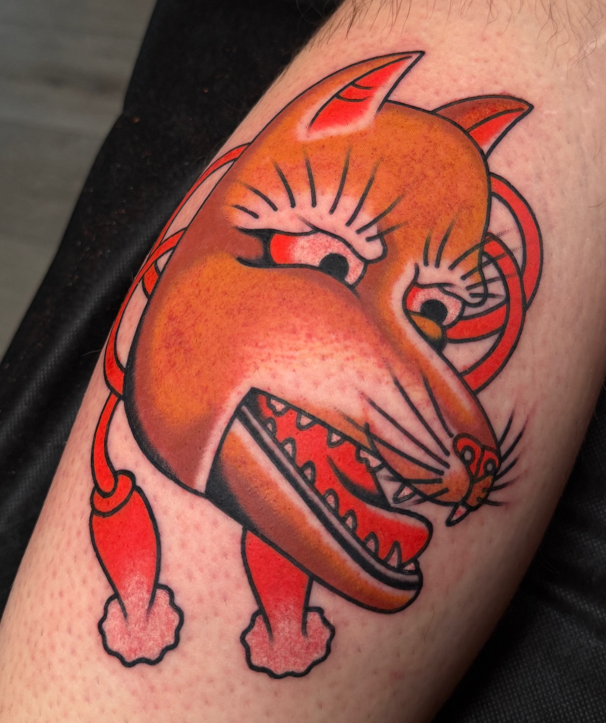 Cat American traditional tattoo on the thigh by Chaz Otto